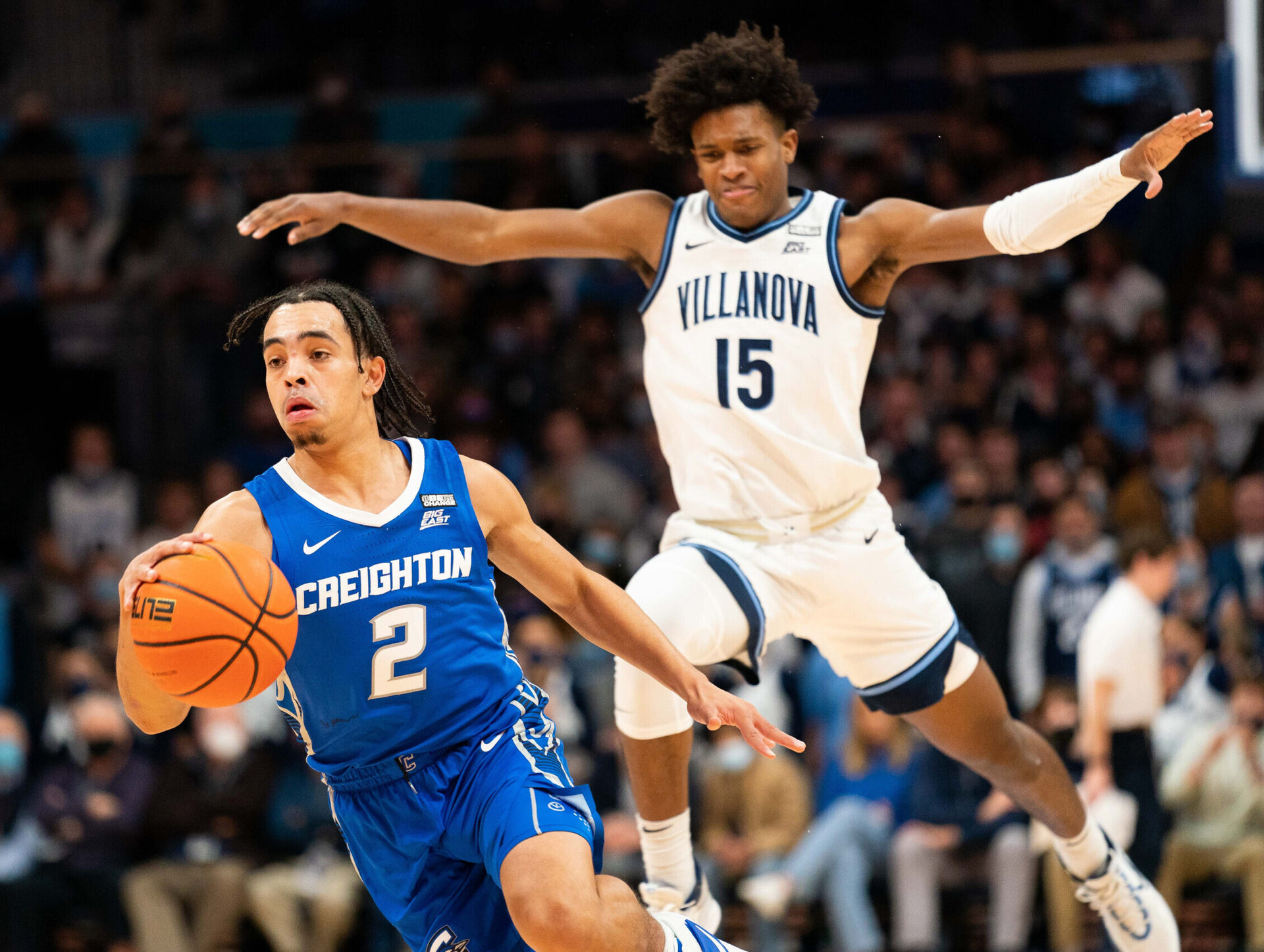 Creighton Bluejays guard Ryan Nembhard (right) dribbles the ball with his right hand and gets past Villanova Wildcats guard Jordan Longino (right) during a Big East basketball game