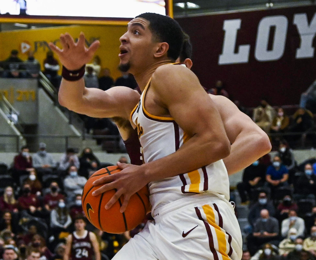 Jan 25, 2022; Chicago, Illinois, USA; Loyola (Il) Ramblers guard Lucas Williamson (1) drives to the basket against Southern Illinois Salukis forward Troy D'Amico (23) during the second half at Joseph J. Gentile Arena.