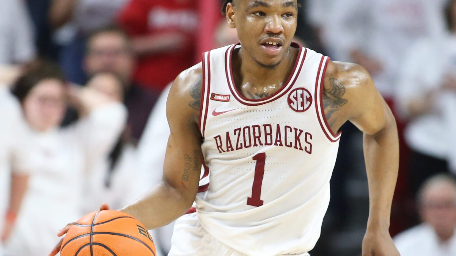 Arkansas Razorbacks guard JD Notae dribbles the ball during an SEC basketball game against the Auburn Tigers