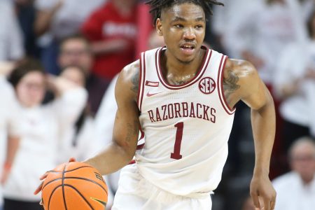 Arkansas Razorbacks guard JD Notae dribbles the ball during an SEC basketball game against the Auburn Tigers