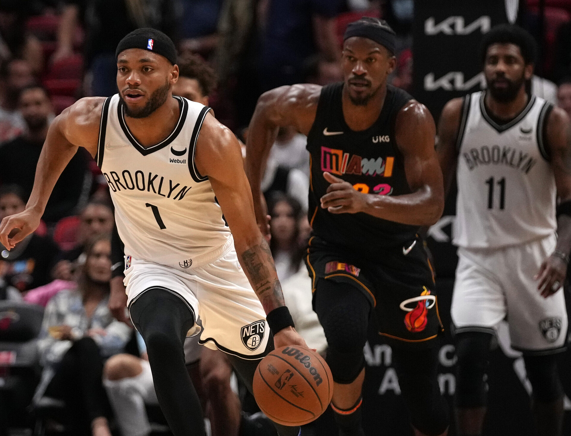 Brooklyn Nets forward Bruce Brown (left) dribbles the ball up the court against the Miami Heat