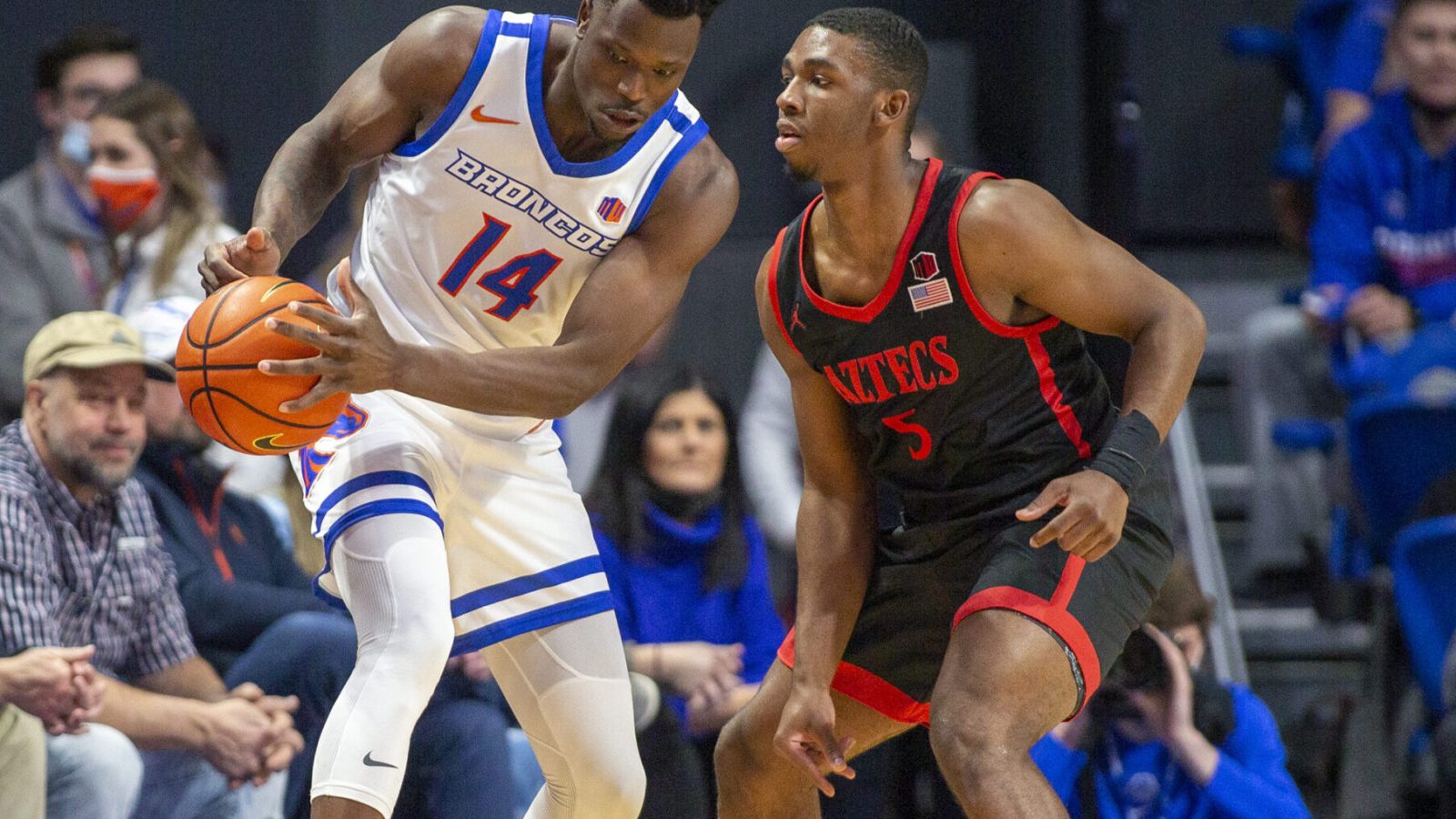 San Diego State Aztecs guard Lamont Butler (right) defends as Boise State Broncos guard Emmanuel Akot (left) tries to control the basketball with both hands during a Mountain West Conference basketball game