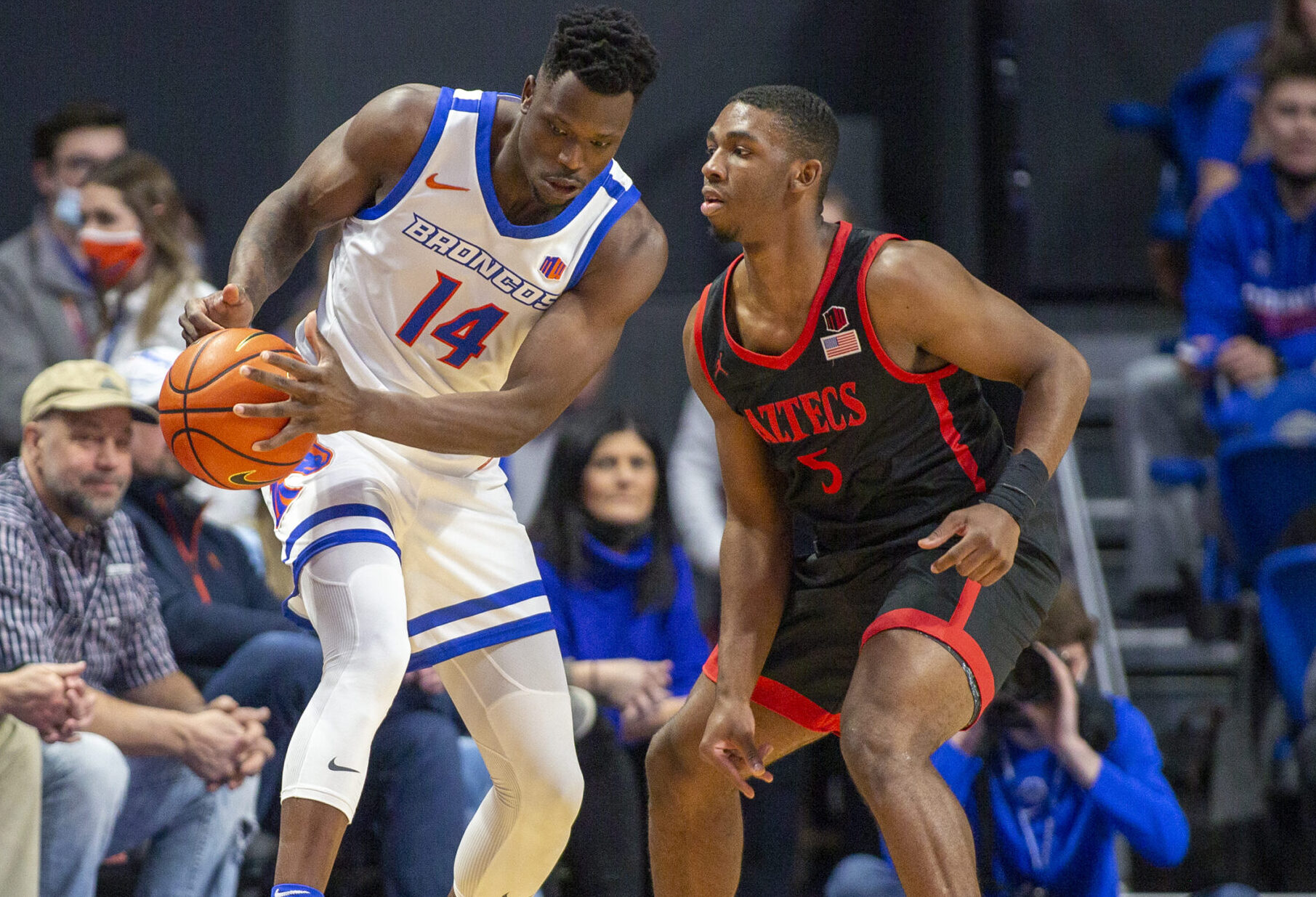 San Diego State Aztecs guard Lamont Butler (right) defends as Boise State Broncos guard Emmanuel Akot (left) tries to control the basketball with both hands during a Mountain West Conference basketball game