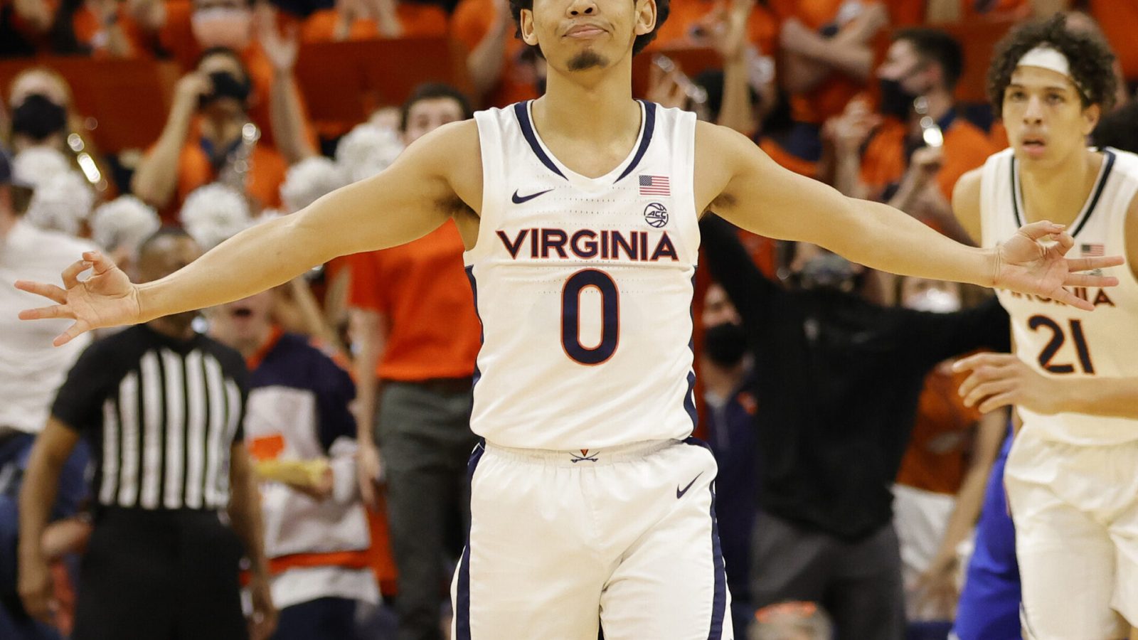 Virginia Cavaliers guard Kihei Clark (foreground) reacts after making a 3-point basket during an ACC basketball game against the Duke Blue Devils