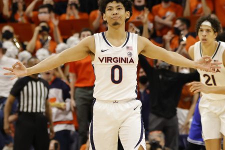 Virginia Cavaliers guard Kihei Clark (foreground) reacts after making a 3-point basket during an ACC basketball game against the Duke Blue Devils