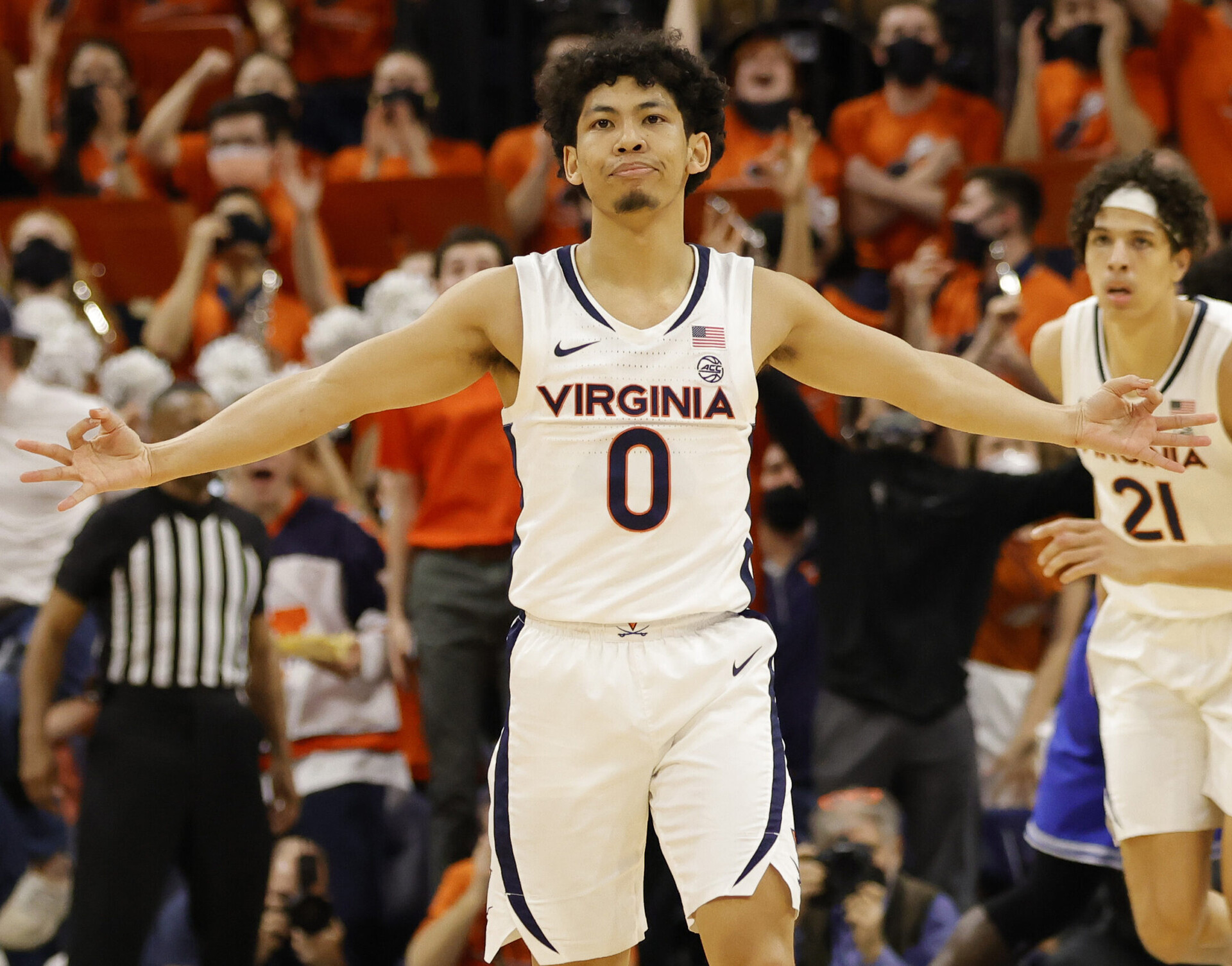 Virginia Cavaliers guard Kihei Clark (foreground) reacts after making a 3-point basket during an ACC basketball game against the Duke Blue Devils