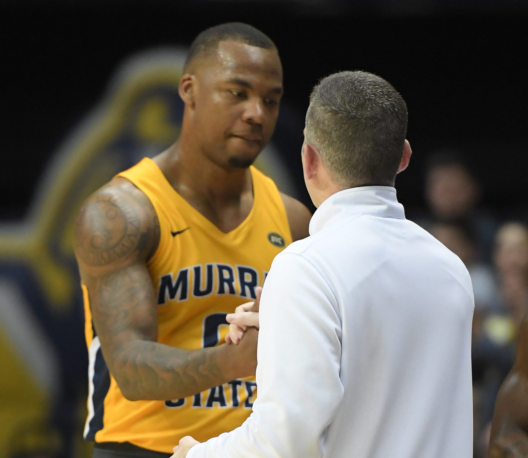 Feb 24, 2022; Murray, Kentucky, USA; Murray State Racers head coach Matt McMahon shakes hands with forward KJ Williams (0) as he comes off the court against the Belmont Bruins during second half at CFSB Center.