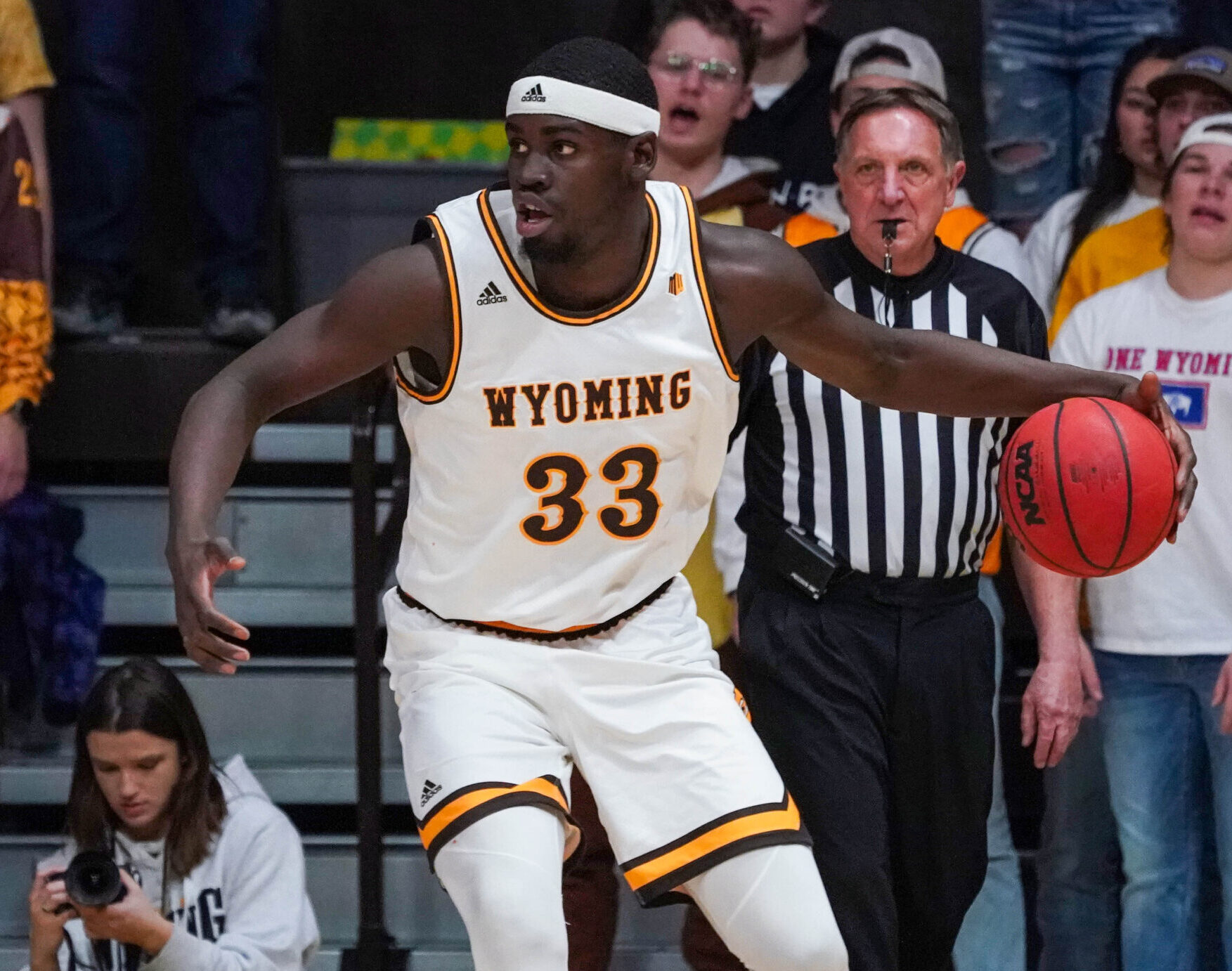 Wyoming Cowboys forward Graham Ike dribbles the ball with his left hand during a Mountain West Conference basketball game against the San Diego State Aztecs