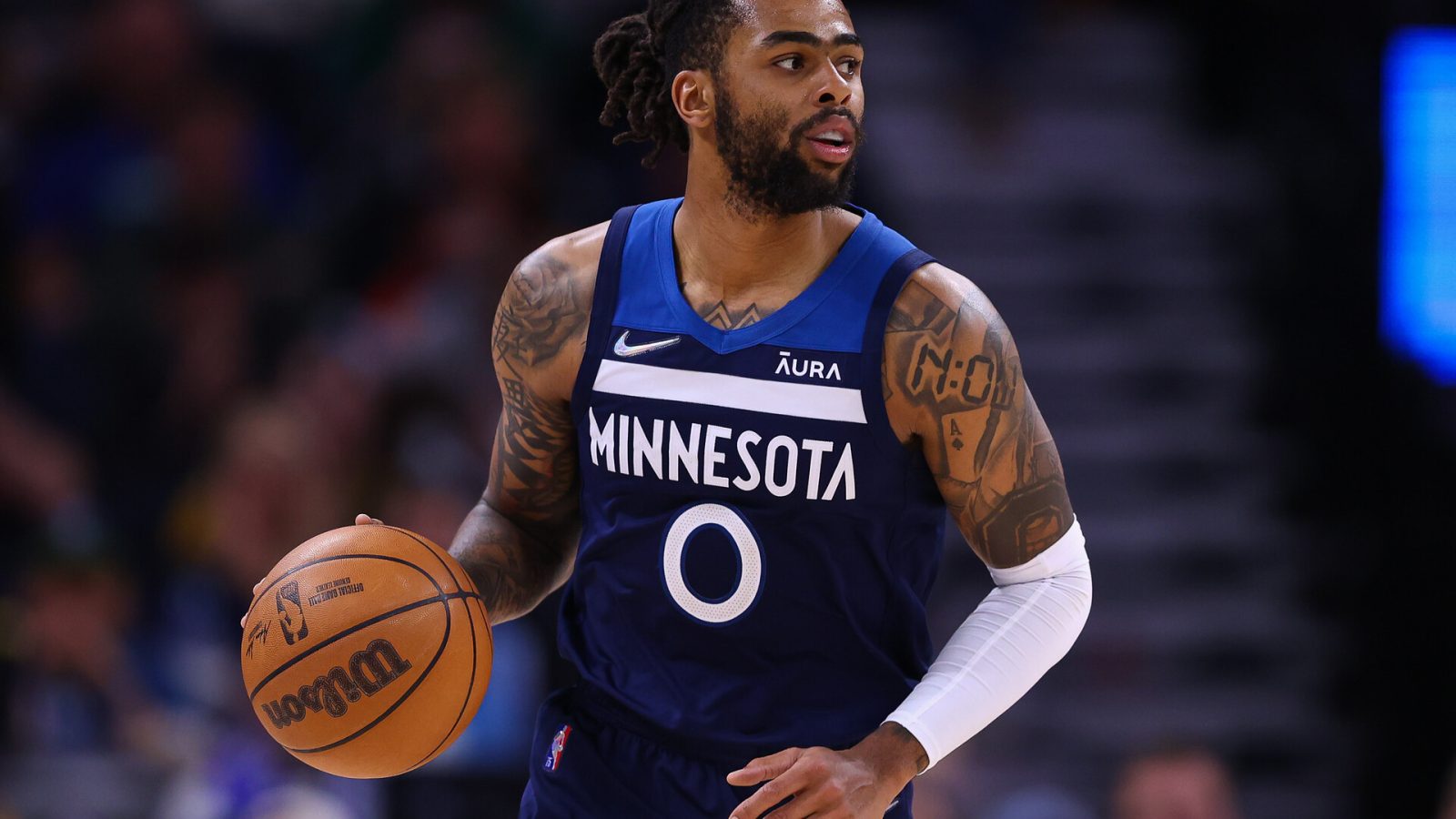 Minnesota Timberwolves guard D'Angelo Russell dribbles the ball during a game against the Golden State Warriors