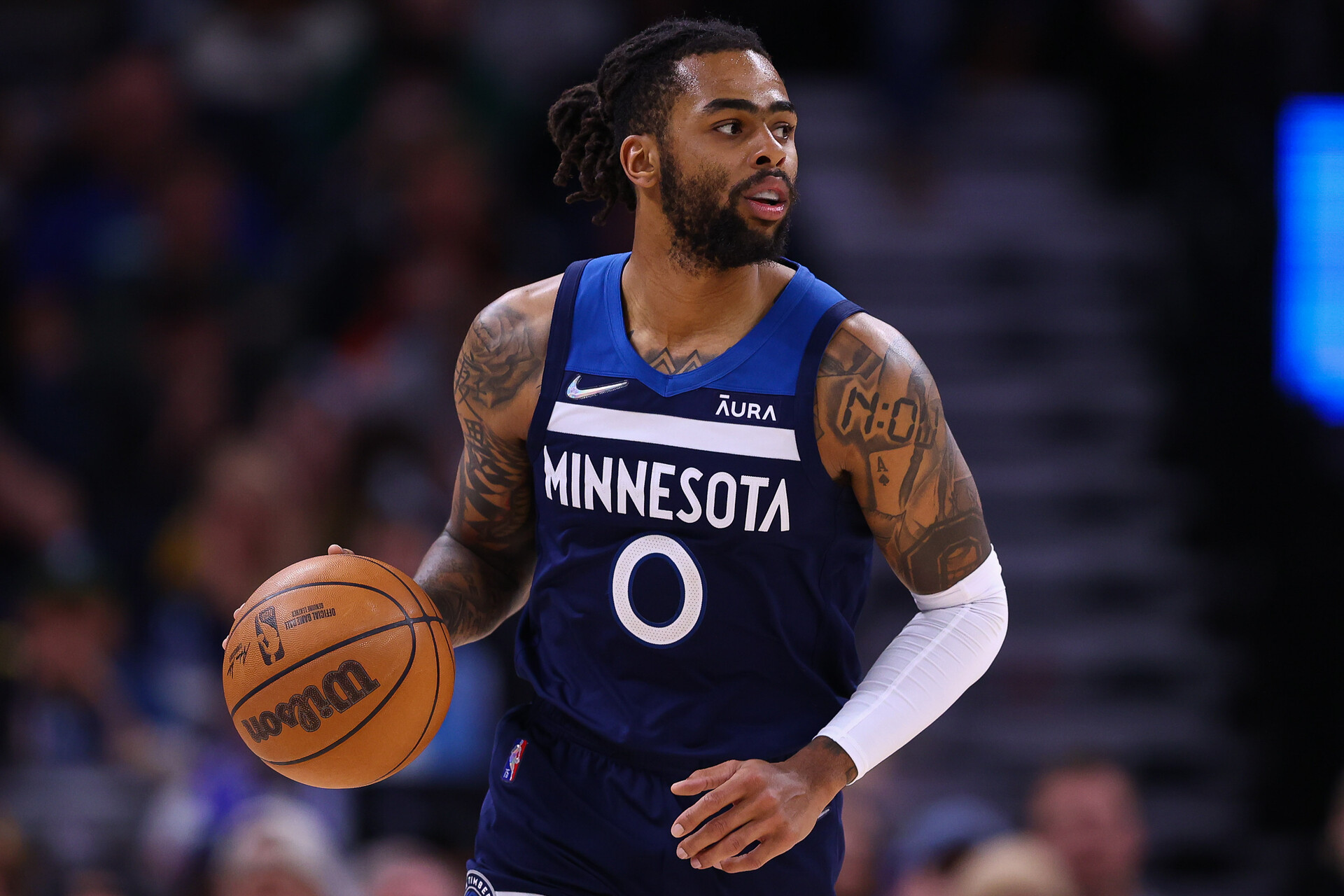 Minnesota Timberwolves guard D'Angelo Russell dribbles the ball during a game against the Golden State Warriors