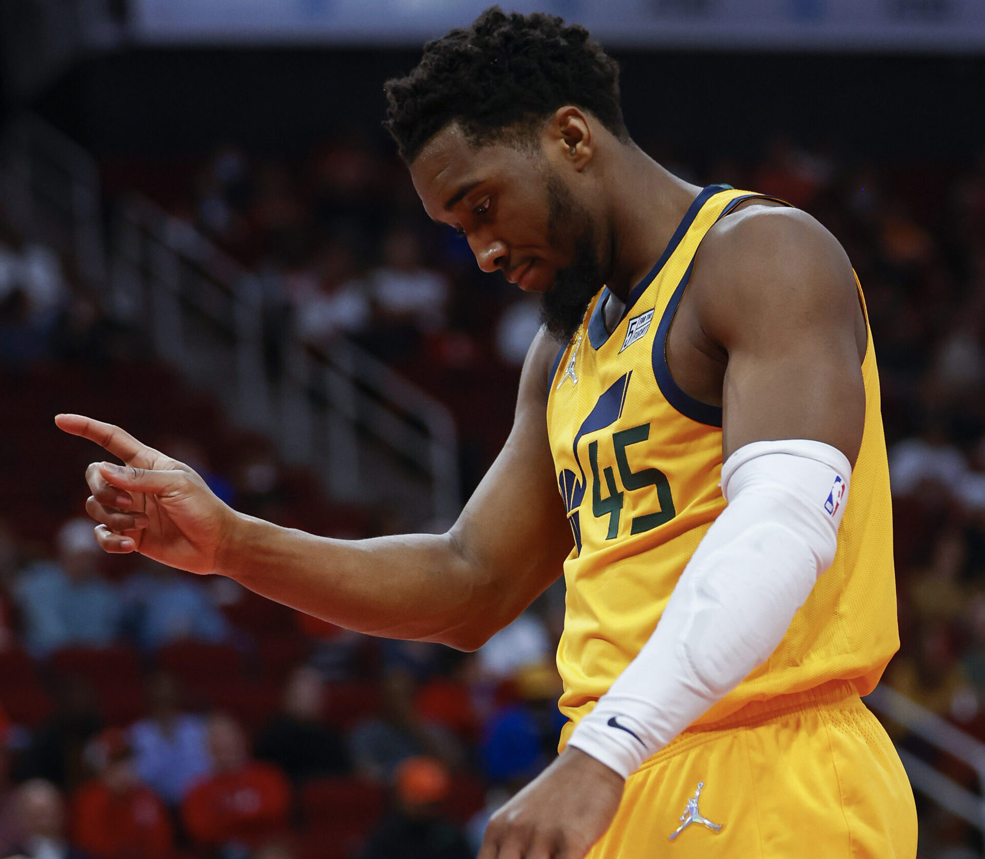 Mar 2, 2022; Houston, Texas, USA; Utah Jazz guard Donovan Mitchell (45) reacts after scoring a basket during the second quarter against the Houston Rockets at Toyota Center. Mandatory Credit: Troy Taormina-USA TODAY Sports