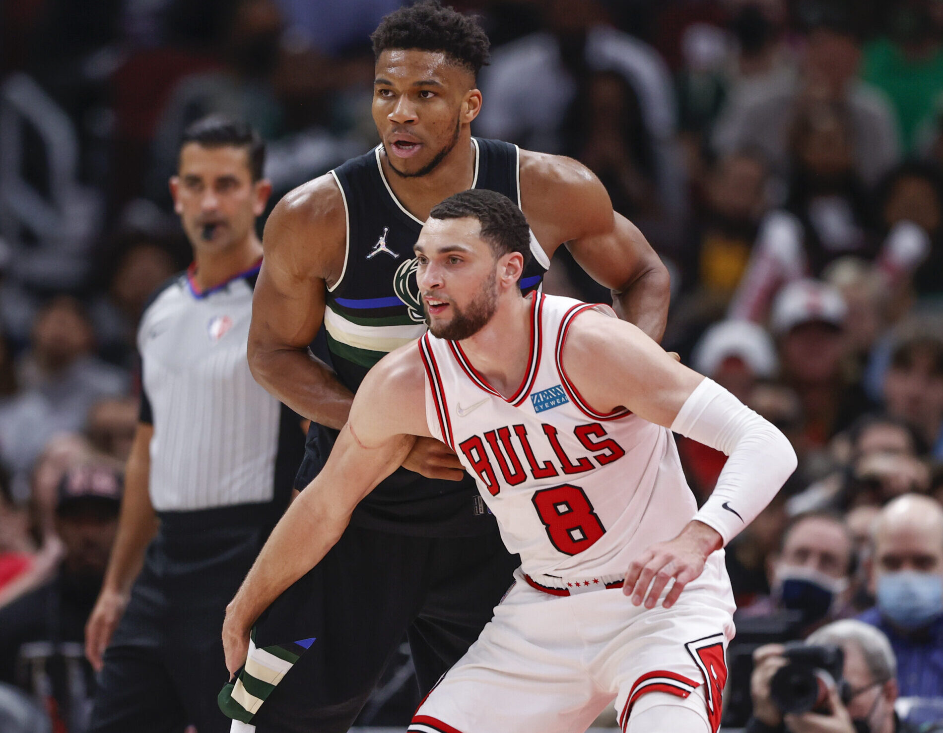 Chicago Bulls guard Zach LaVine (right) fronts Milwaukee Bucks forward Giannis Antetokounmpo (left) while trying to deny a pass