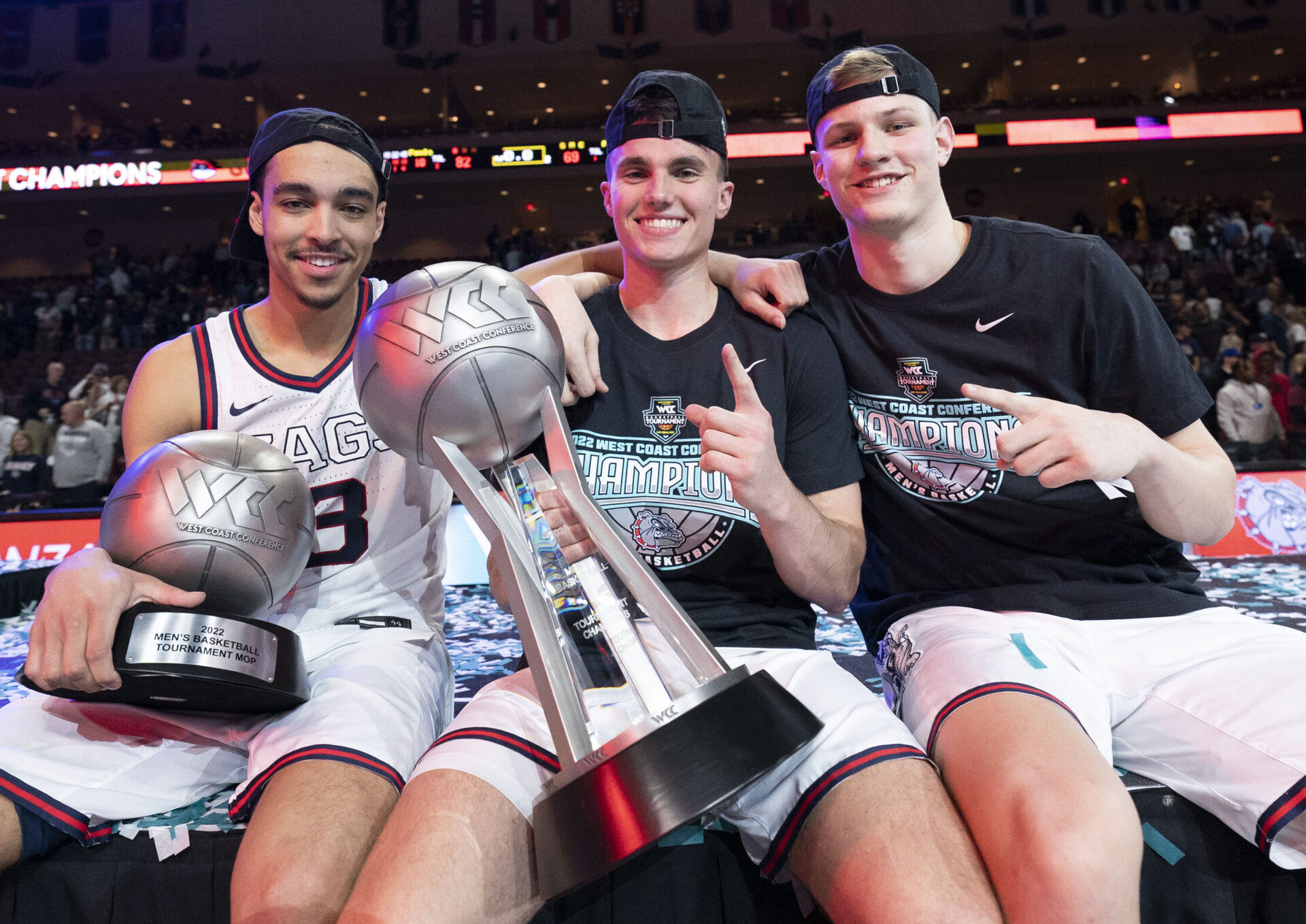 Gonzaga Bulldogs guard Andrew Nembhard (left), guard Matthew Langl (center), and forward Ben Gregg (right) pose for a photo after defeating the Saint Mary's Gaels for the West Coast Conference tournament title