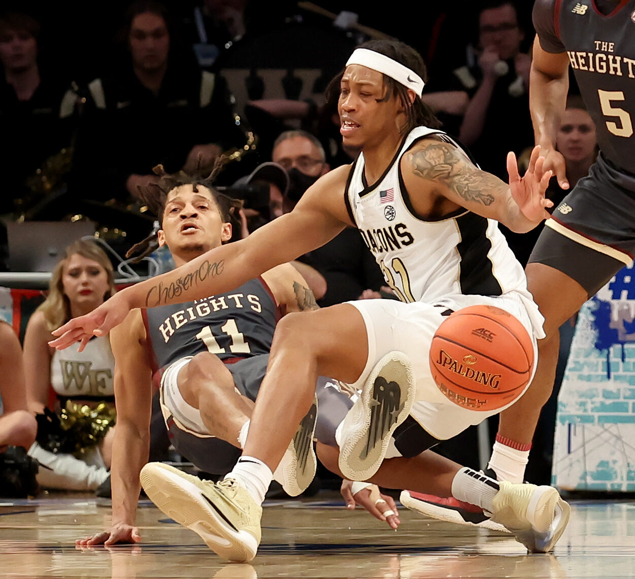 Wake Forest Demon Deacons guard Alondes Williams (31) commits an offensive foul as he drives to the basket against Boston College Eagles guard Makai Ashton-Langford (11) in front of Boston College guard DeMarr Langford Jr. (5) during the second half at Barclays Center in Brooklyn on March 9, 2022.