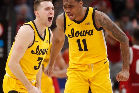 Iowa Hawkeyes guard Jordan Bohannon (3) and Iowa Hawkeyes guard Tony Perkins (11) celebrate during the men’s Big Ten tournament game against the Indiana Hoosiers, Saturday, March 12, 2022, at Gainbridge Fieldhouse in Indianapolis. The Hawkeyes won 80-77.