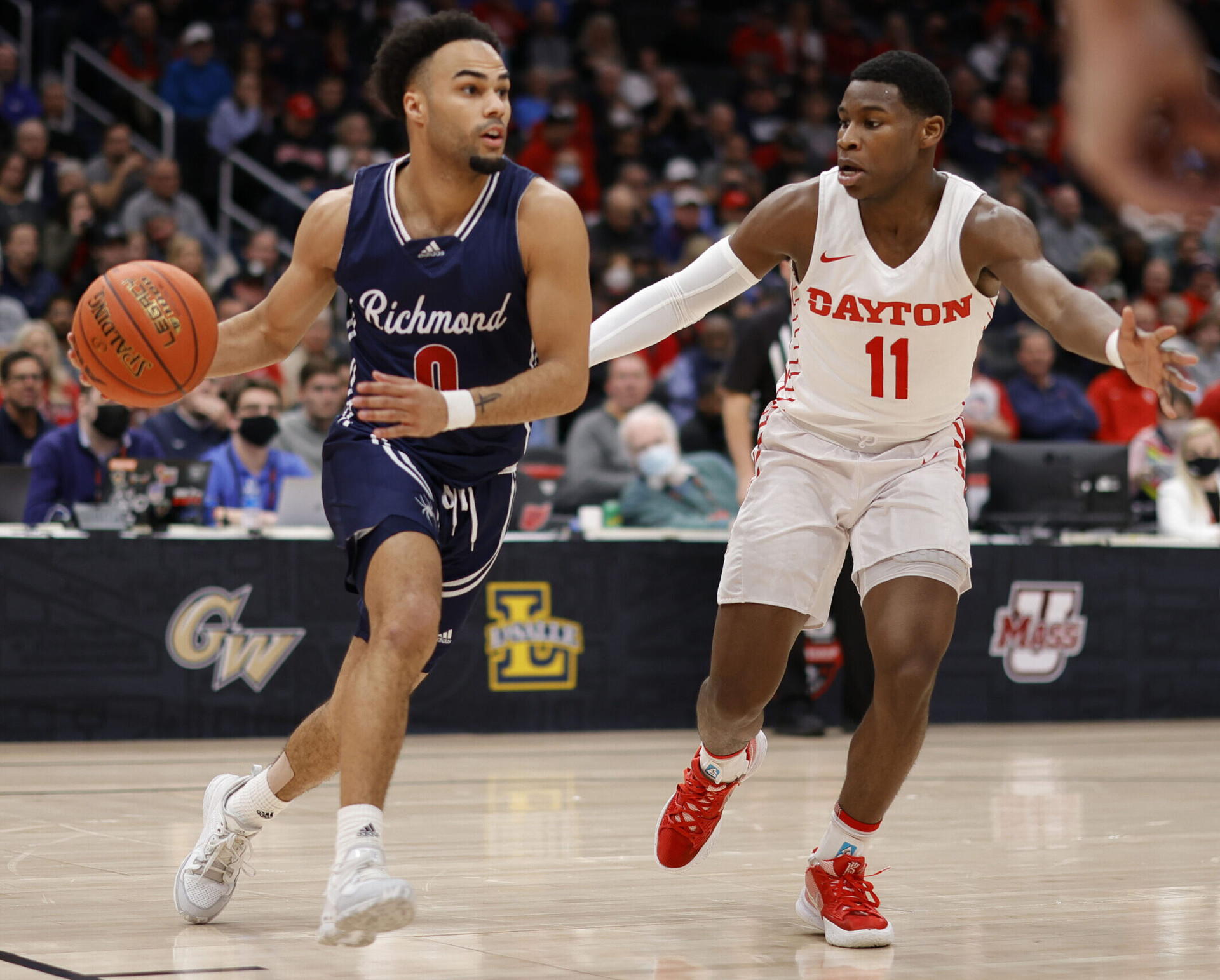 Richmond Spiders guard Jacob Gilyard (0) drives to the basket as Dayton Flyers guard Malachi Smith (11) defends in the first half at Capital One Arena in Washington, D.C., on March 12, 2022.