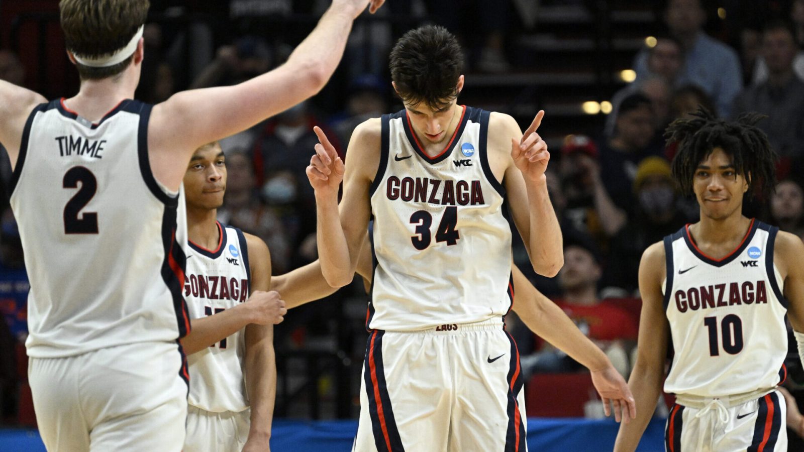 Gonzaga Bulldogs center Chet Holmgren (34) and forward Drew Timme (2) and guard Hunter Sallis (10) react during their NCAA Tournament game against the Georgia State Panthers