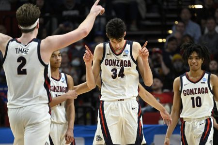 Gonzaga Bulldogs center Chet Holmgren (34) and forward Drew Timme (2) and guard Hunter Sallis (10) react during their NCAA Tournament game against the Georgia State Panthers