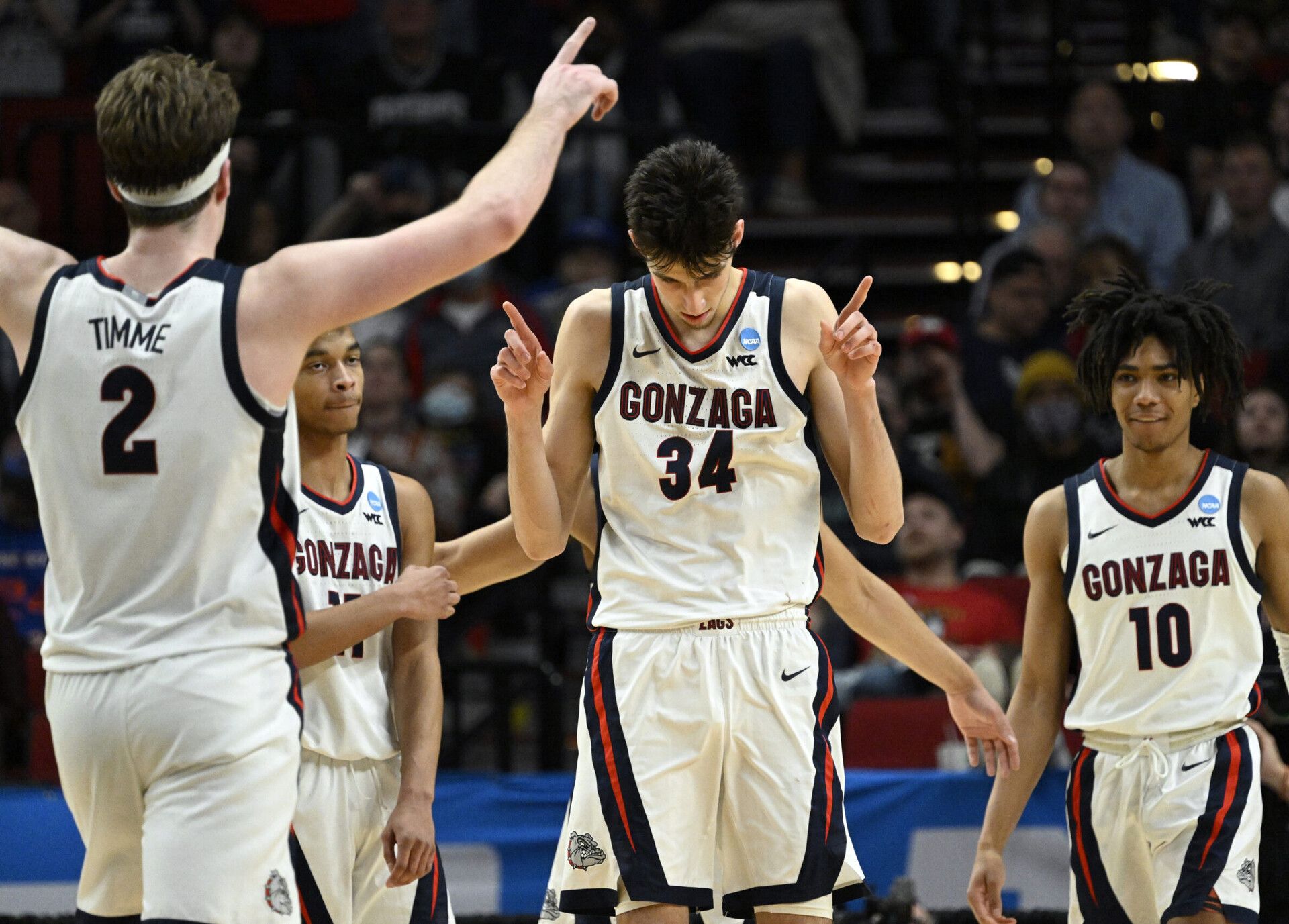 Gonzaga Bulldogs center Chet Holmgren (34) and forward Drew Timme (2) and guard Hunter Sallis (10) react during their NCAA Tournament game against the Georgia State Panthers
