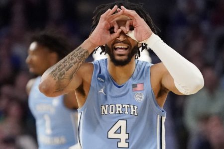 North Carolina Tar Heels guard R.J. Davis (4) celebrates a basket against the Baylor Bears during the second round of the 2022 NCAA Tournament at Dickies Arena in Fort Worth, Texas, on Sunday, March 20.