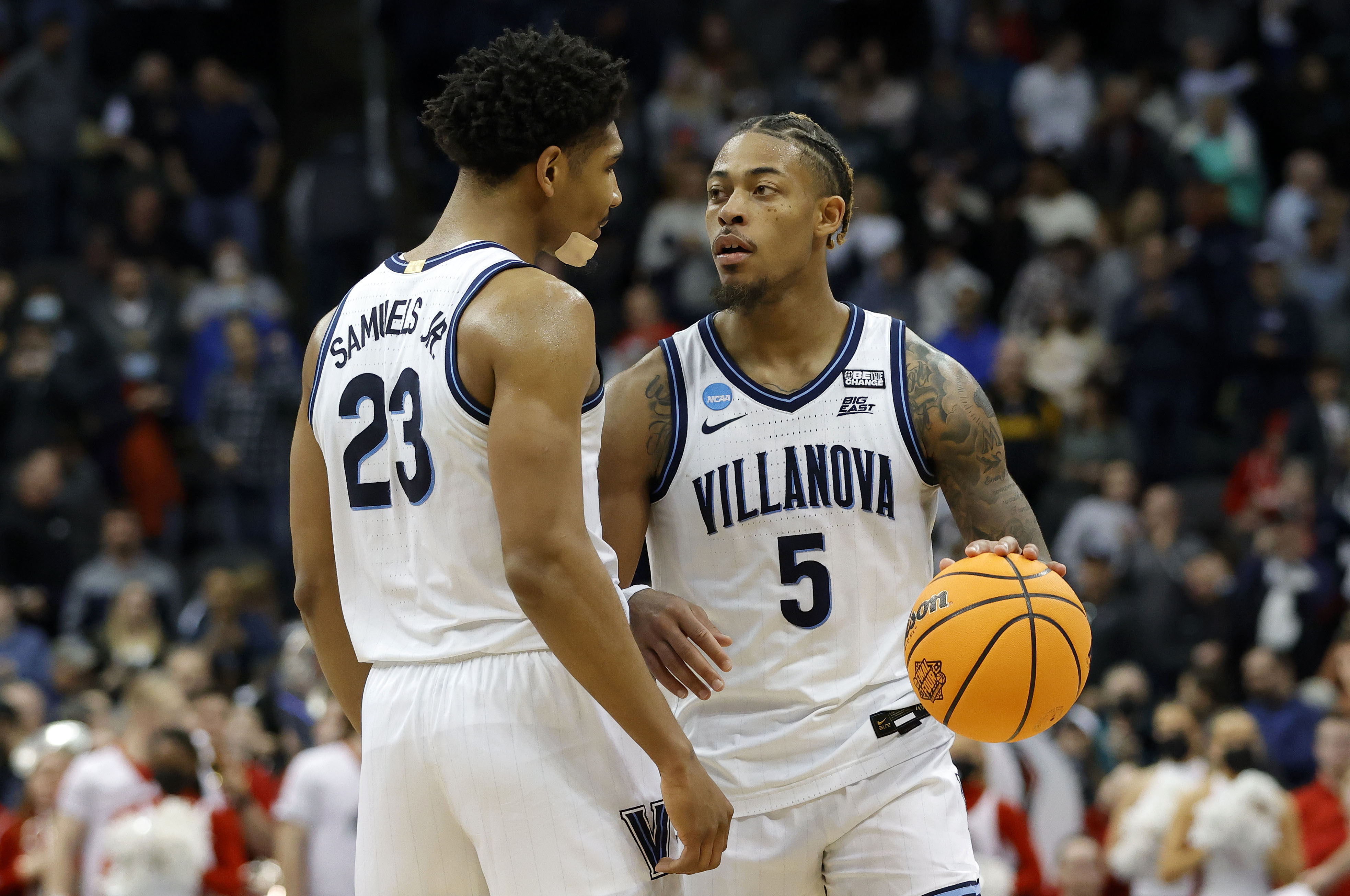 Villanova Wildcats guard Justin Moore (5) reacts with forward Jermaine Samuels (23) in the second half during the second round of the 2022 NCAA Tournament at PPG Paints Arena.