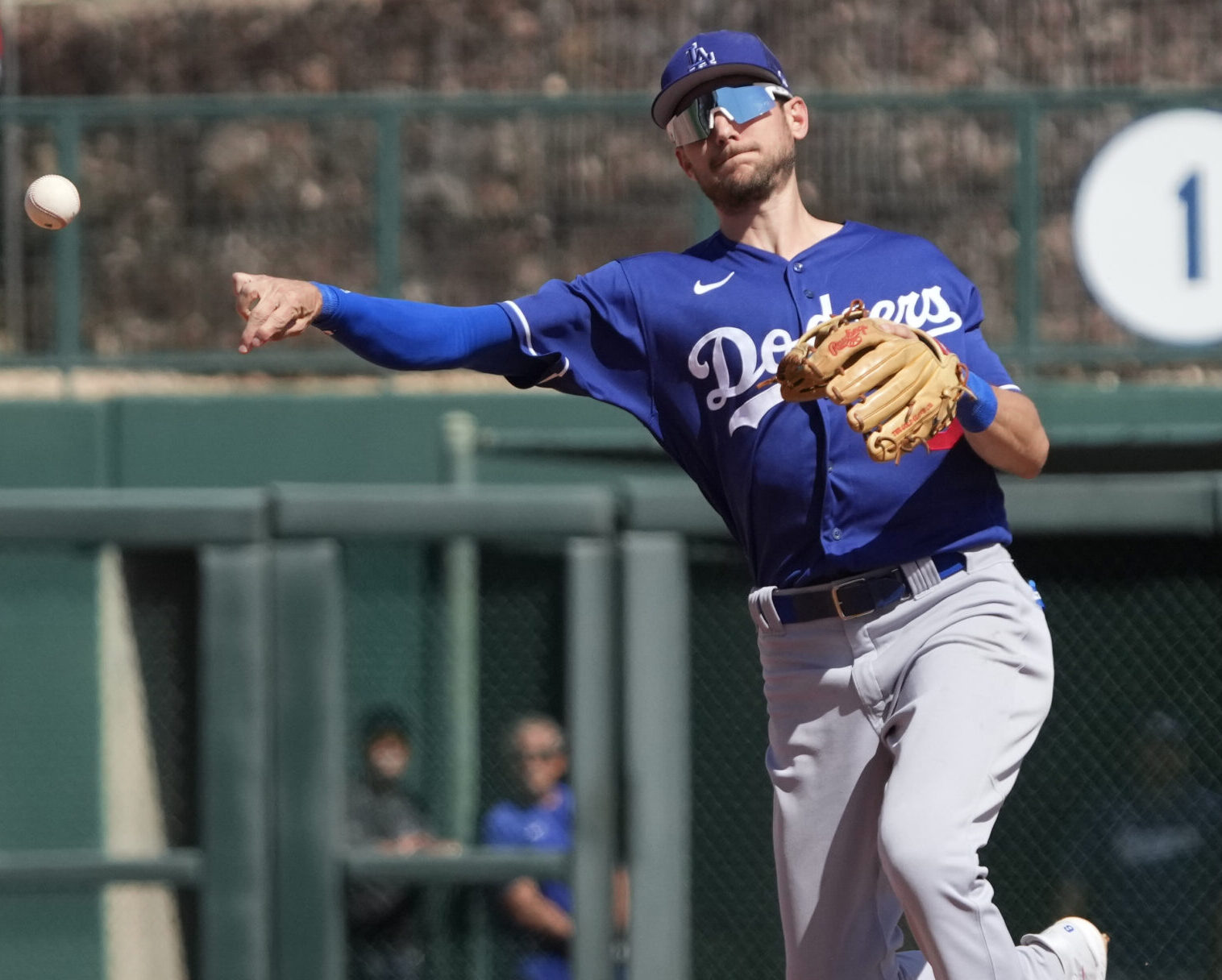 Los Angeles Dodgers shortstop Trea Turner throws the ball to first place during a spring training game against the Chicago White Sox