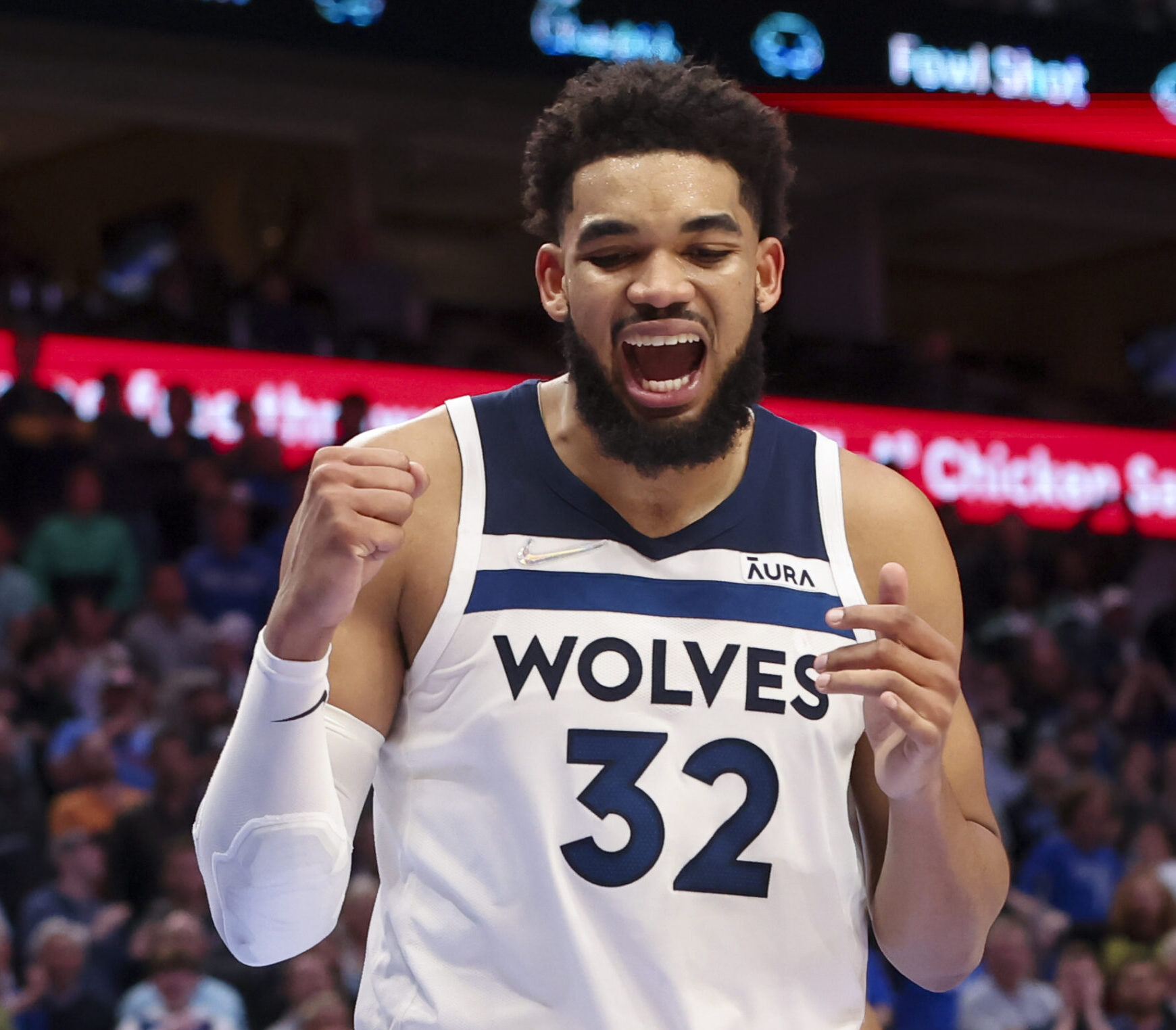 Minnesota Timberwolves center Karl-Anthony Towns pumps his fist and shouts after making a play against the Dallas Mavericks