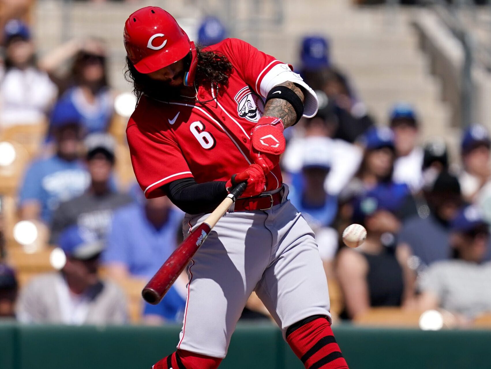 Cincinnati Reds second baseman Jonathan India prepares to make contact with the baseball that results in a single during a spring training game against the Los Angeles Dodgers