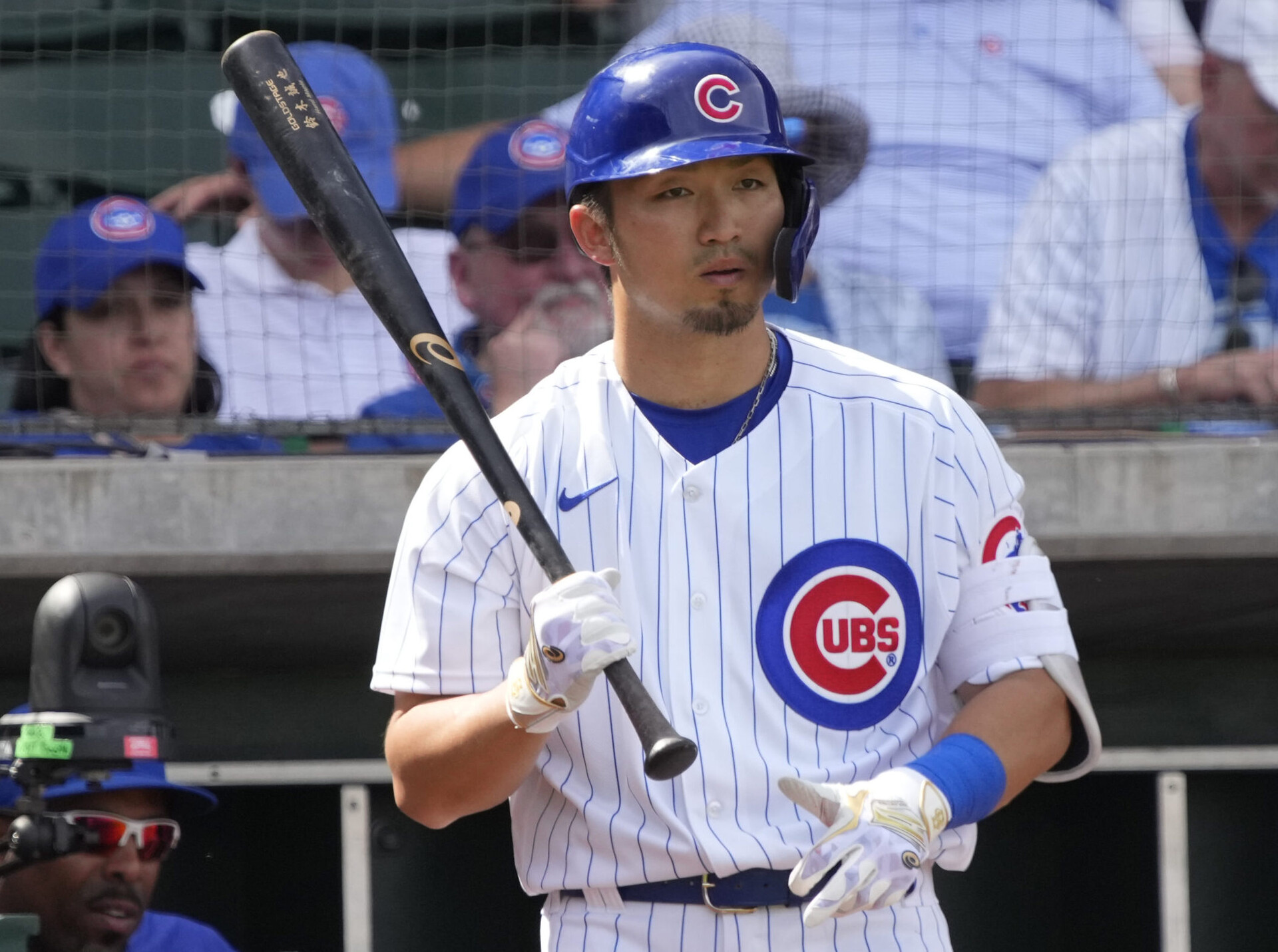 Chicago Cubs right fielder Seiya Suzuki looks on during an at-bat against the Colorado Rockies in a spring training game
