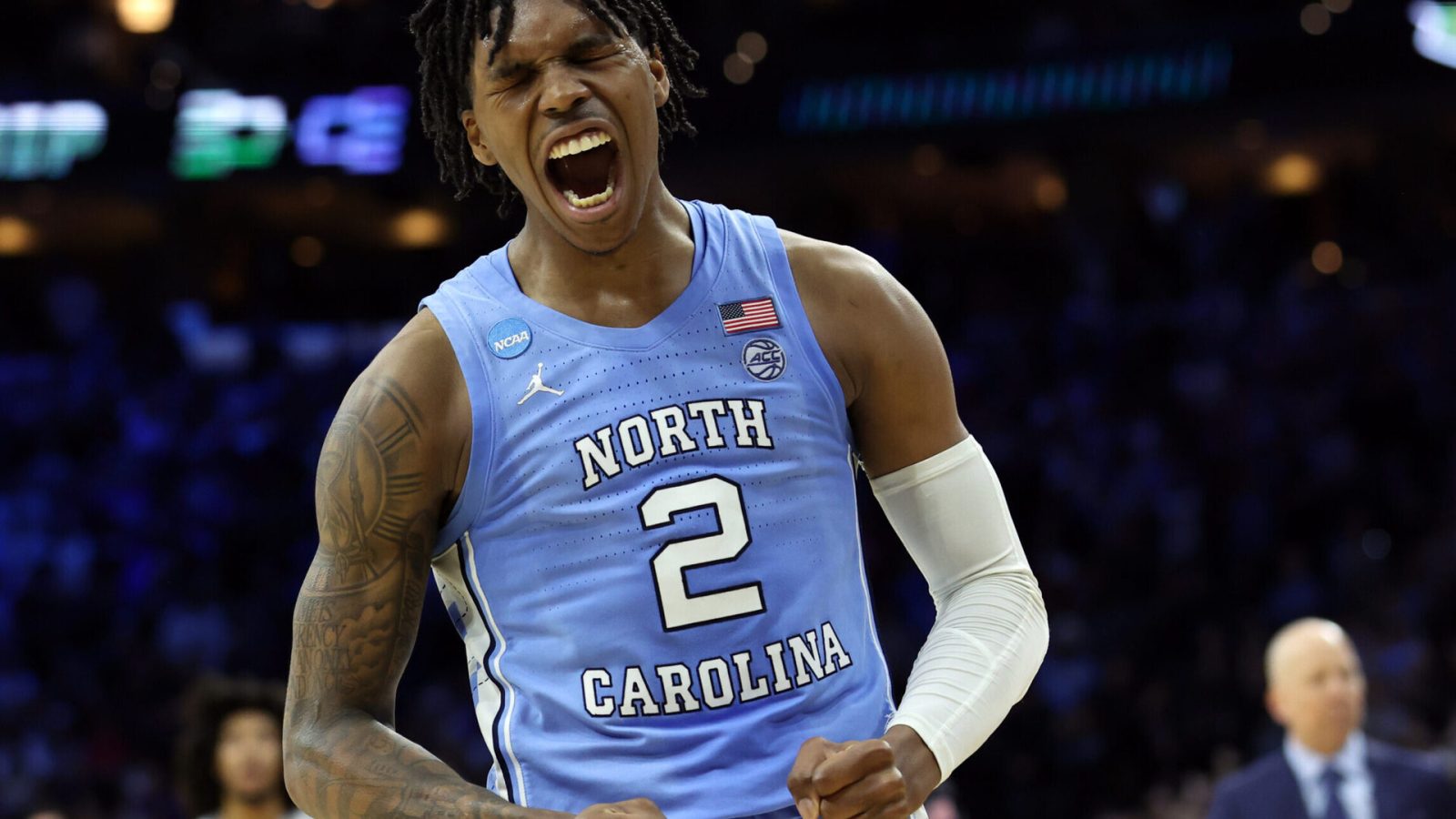 North Carolina Tar Heels guard Caleb Love shouts and pumps his fists after making a play against the UCLA Bruins in the semifinals of the East regional of the men's college basketball NCAA Tournament