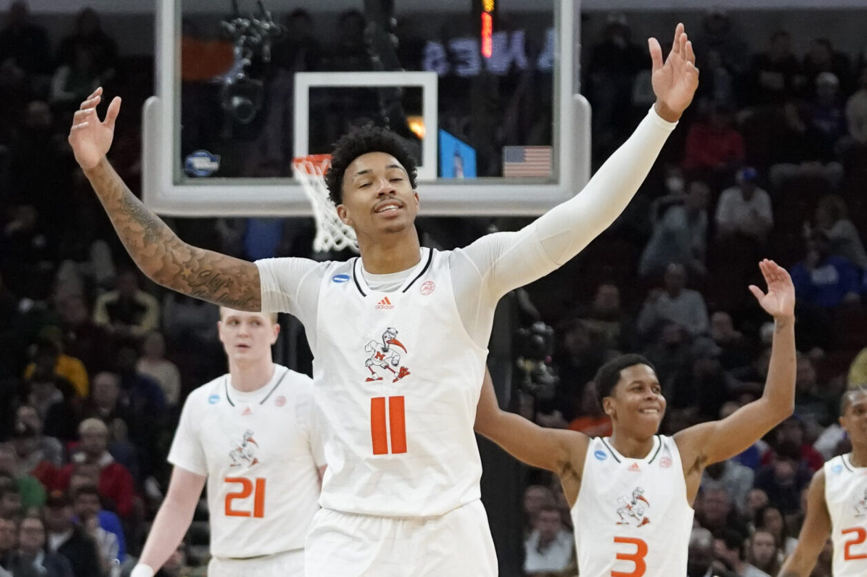 Miami Hurricanes guard Jordan Miller (11) reacts with teammates after a time out during the second half against the Iowa State Cyclones in the semifinals of the Midwest regional of the men's college basketball NCAA Tournament at United Center in Chicago on Friday, March 25, 2022.