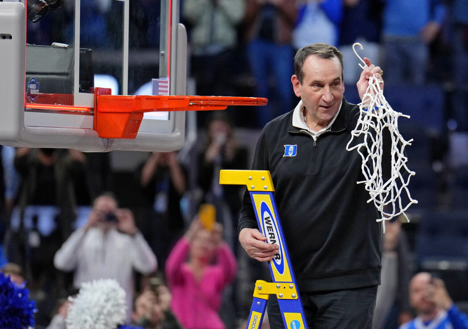 Duke Blue Devils head coach Mike Krzyzewski holds the net as they celebrate their win over the Arkansas Razorbacks in the finals of the West regional of the men's college basketball NCAA Tournament at Chase Center. The Duke Blue Devils won 78-69 at Chase Center in San Francisco on Saturday, March 26, 2022.