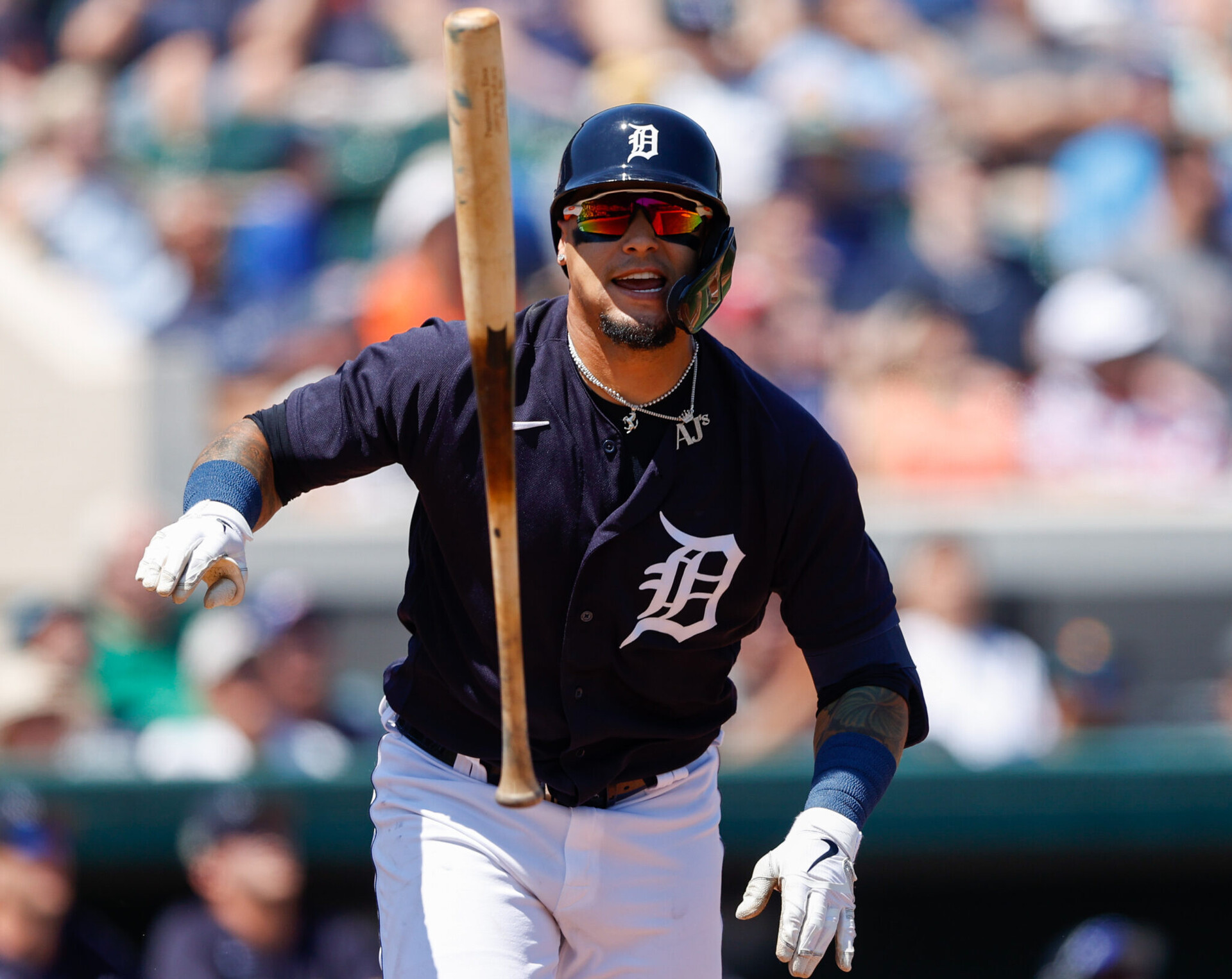 Detroit Tigers shortstop Javier Baez flips his bat as he leaves home plate during a spring training game against the New York Yankees