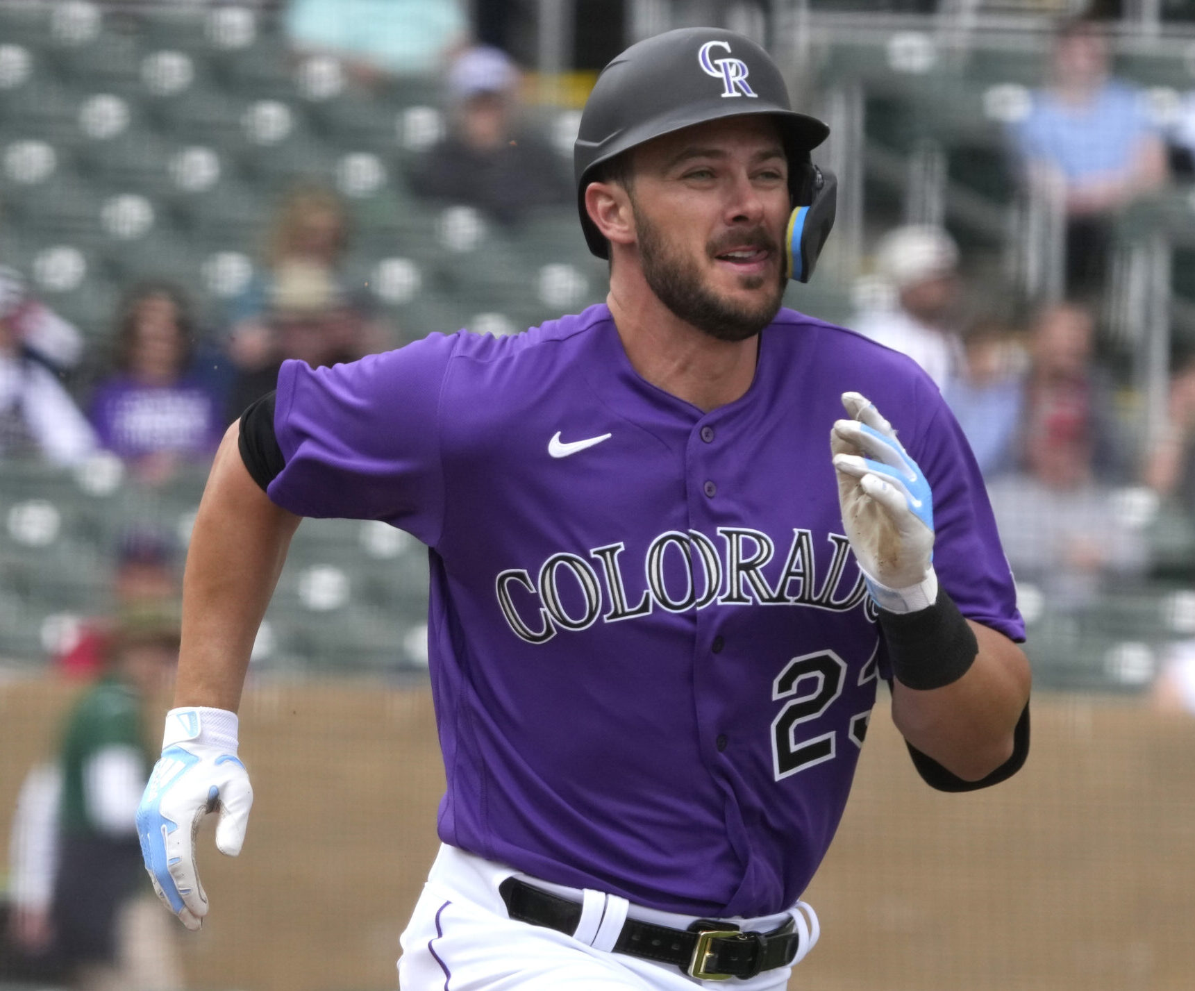 Colorado Rockies left fielder Kris Bryant sprints down the first-base line during an at-bat against against the Los Angeles Angels during a spring training game
