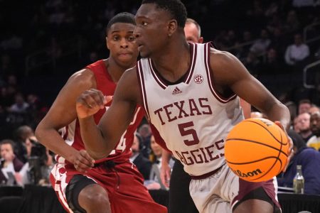 Texas A&M Aggies guard Hassan Diarra (5) dribbles the ball against Washington State Cougars guard Noah Williams (24) during the first half of the NIT college basketball semifinals at Madison Square Garden in New York City on Tuesday, March 29, 2022.