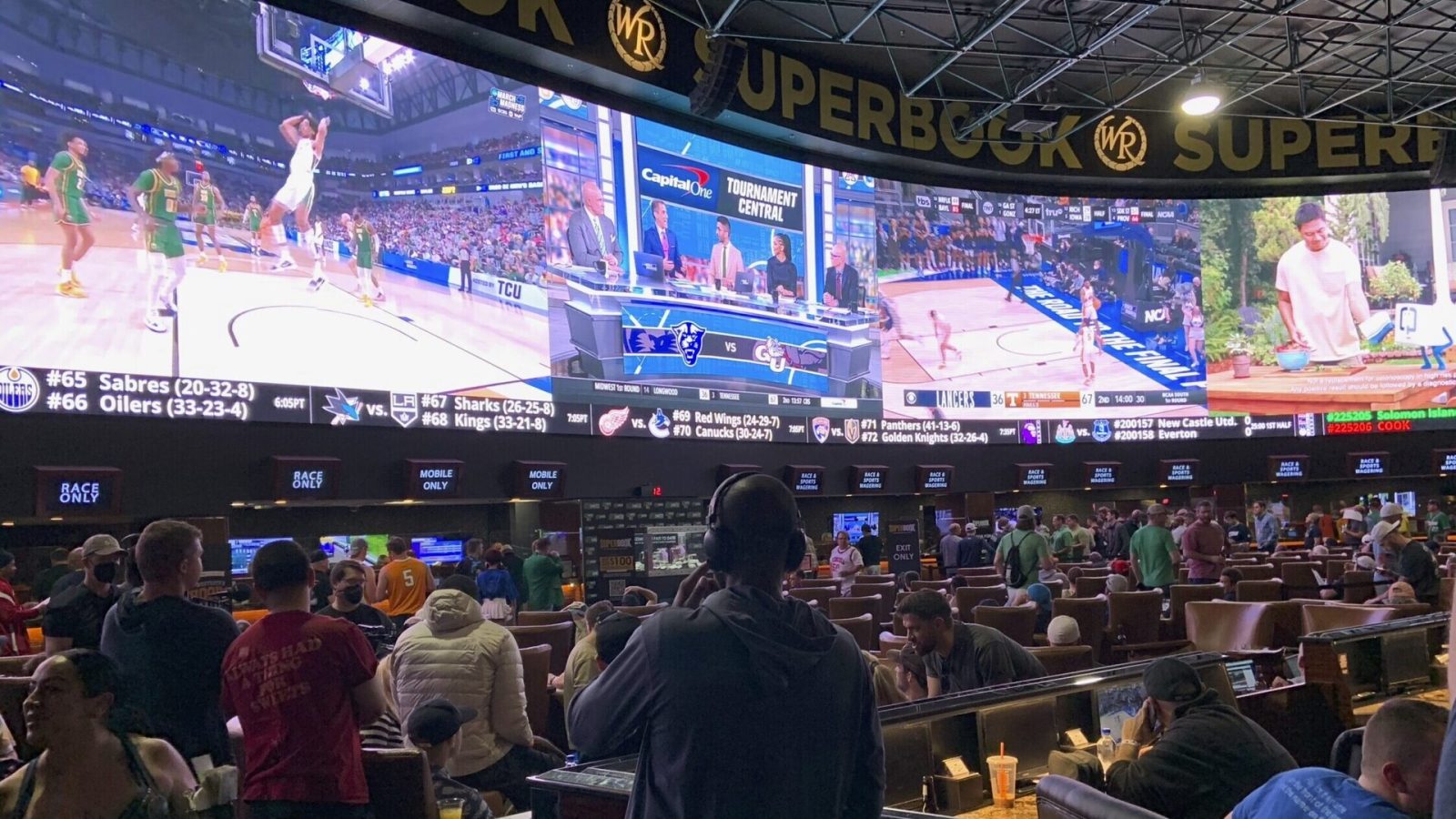 Fans pack the Westgate Las Vegas Sports book during the first day of the 2022 NCAA Tournament