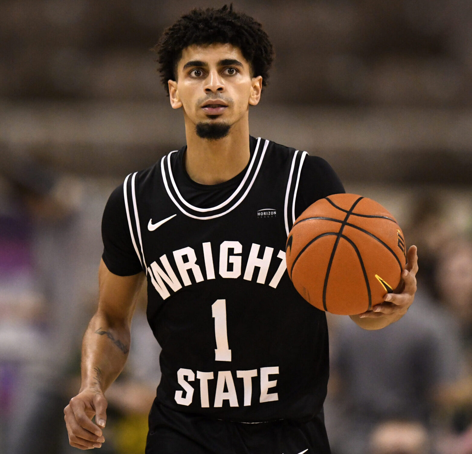 Wright State guard Trey Calvin (1) advances the ball during the Horizon League Tournament Championship game between the Northern Kentucky Norse and the Wright State Raiders on March 8, 2022, at the Indiana Farmers Coliseum in Indianapolis