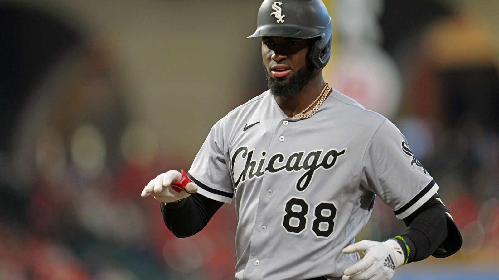 Luis Robert #88 of the Chicago White Sox reacts to hitting a single in the first inning during Game 2 of the ALDS between the Chicago White Sox and the Houston Astros at Minute Maid Park on Friday, October 8, 2021 in Houston, Texas.