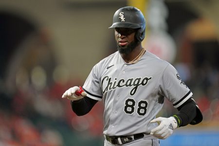 Luis Robert #88 of the Chicago White Sox reacts to hitting a single in the first inning during Game 2 of the ALDS between the Chicago White Sox and the Houston Astros at Minute Maid Park on Friday, October 8, 2021 in Houston, Texas.