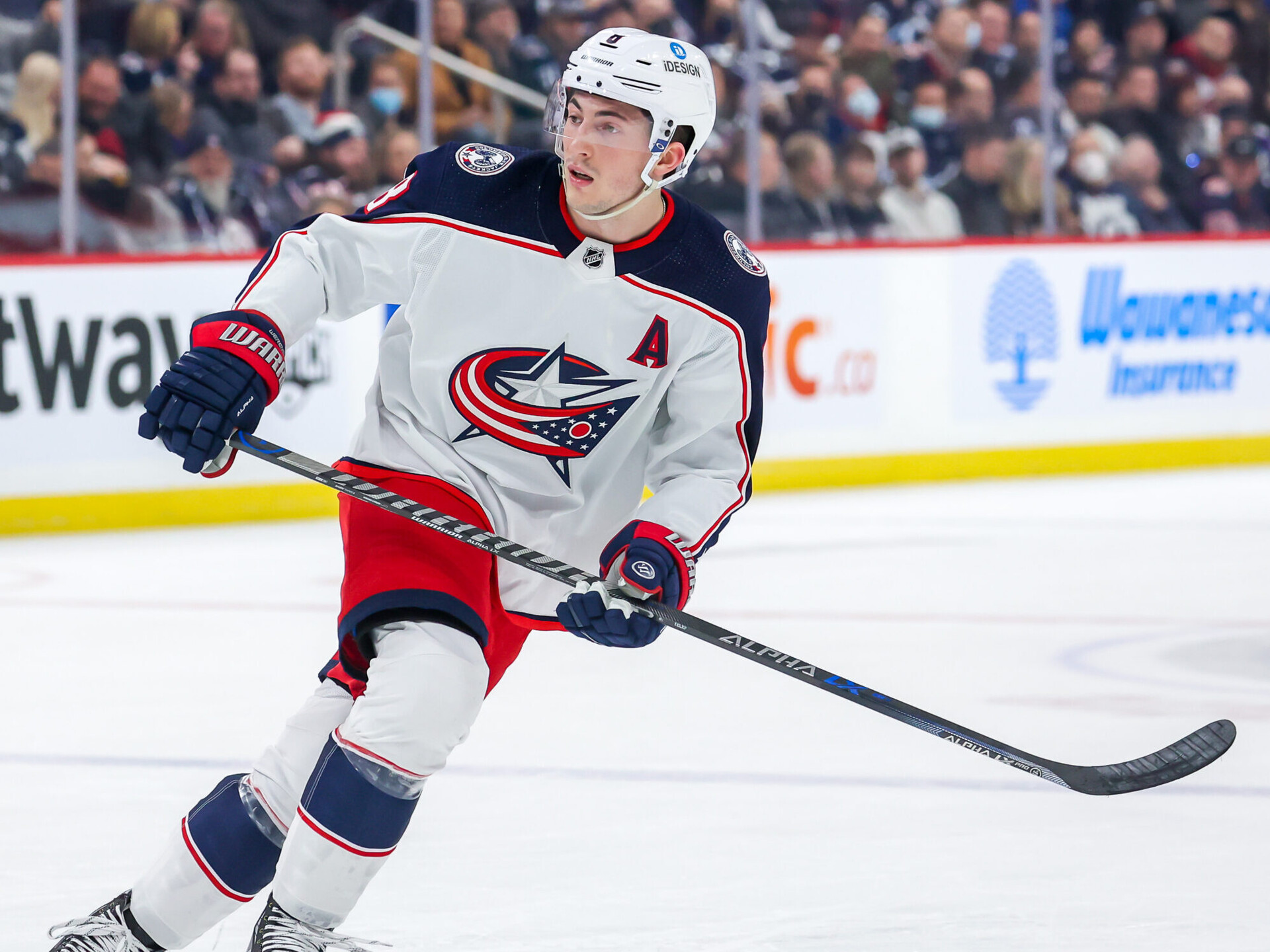 Zach Werenski #8 of the Columbus Blue Jackets keeps an eye on the play