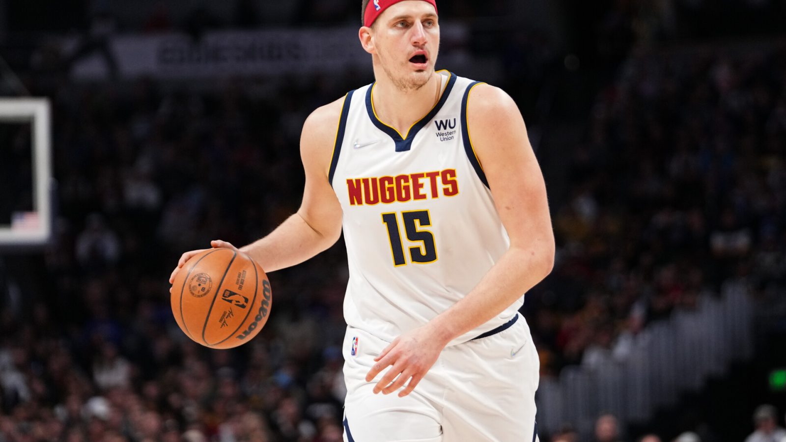 Nikola Jokic #15 of the Denver Nuggets dribbles against the Memphis Grizzlies at Ball Arena on April 7, 2022 in Denver, Colorado.
