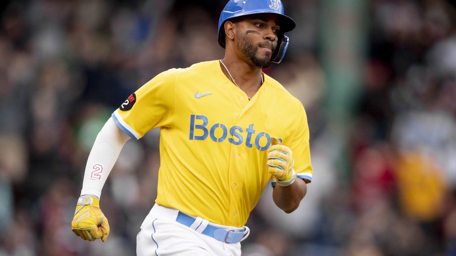 Xander Bogaerts #2 of the Boston Red Sox runs after hitting a two-run home run during the third inning of a game against the Minnesota Twins on April 16, 2022 at Fenway Park in Boston, Massachusetts.