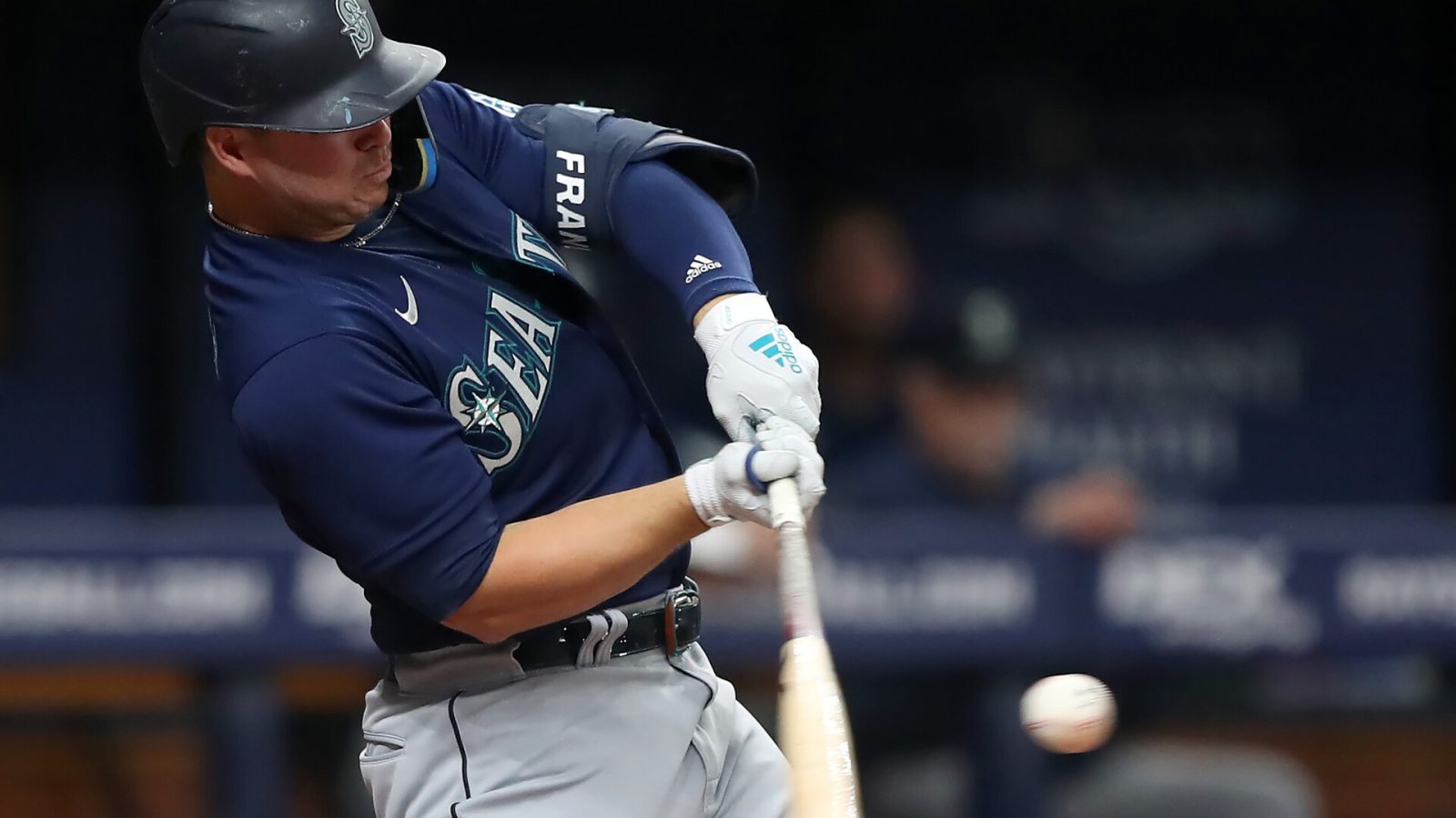 Seattle Mariners first baseman Ty France swings his bat and connects with the baseball for a single against the Tampa Bay Rays