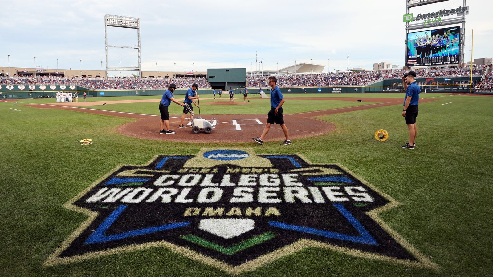 Members of the ground ready the field before the start of the Vanderbilt Commodores and Mississippi St. Bulldogs game three of the College World Series Championship at TD Ameritrade Park Omaha on June 30, 2021 in Omaha, Nebraska.