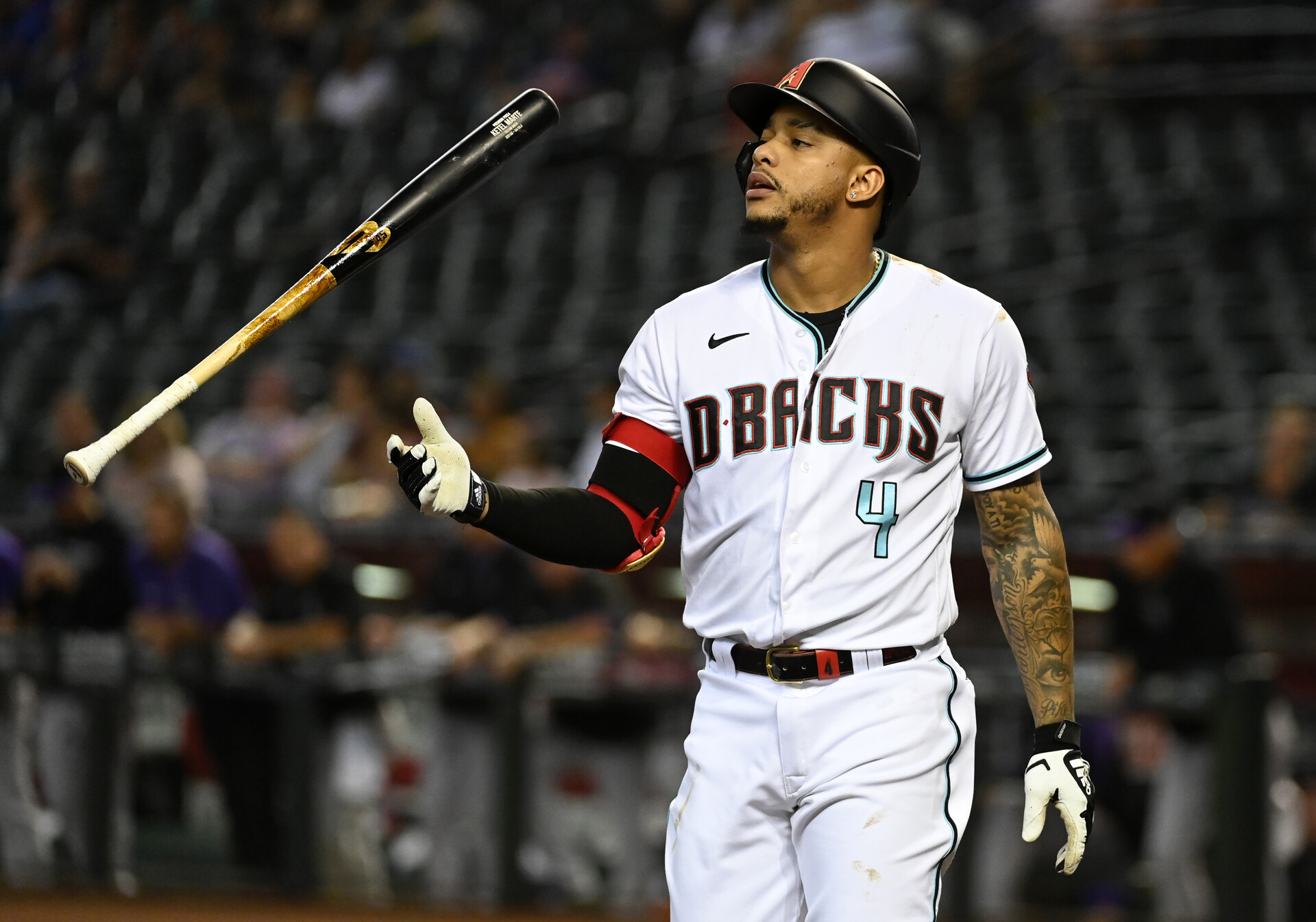 Ketel Marte #4 of the Arizona Diamondbacks tosses his bat after being called out