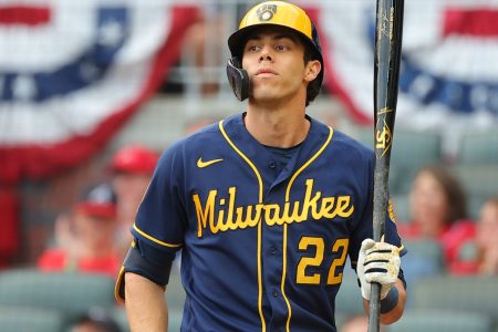 Christian Yelich #22 of the Milwaukee Brewers bats during the second inning against the Atlanta Braves in game four of the National League Division Series at Truist Park on October 12, 2021 in Atlanta, Georgia.
