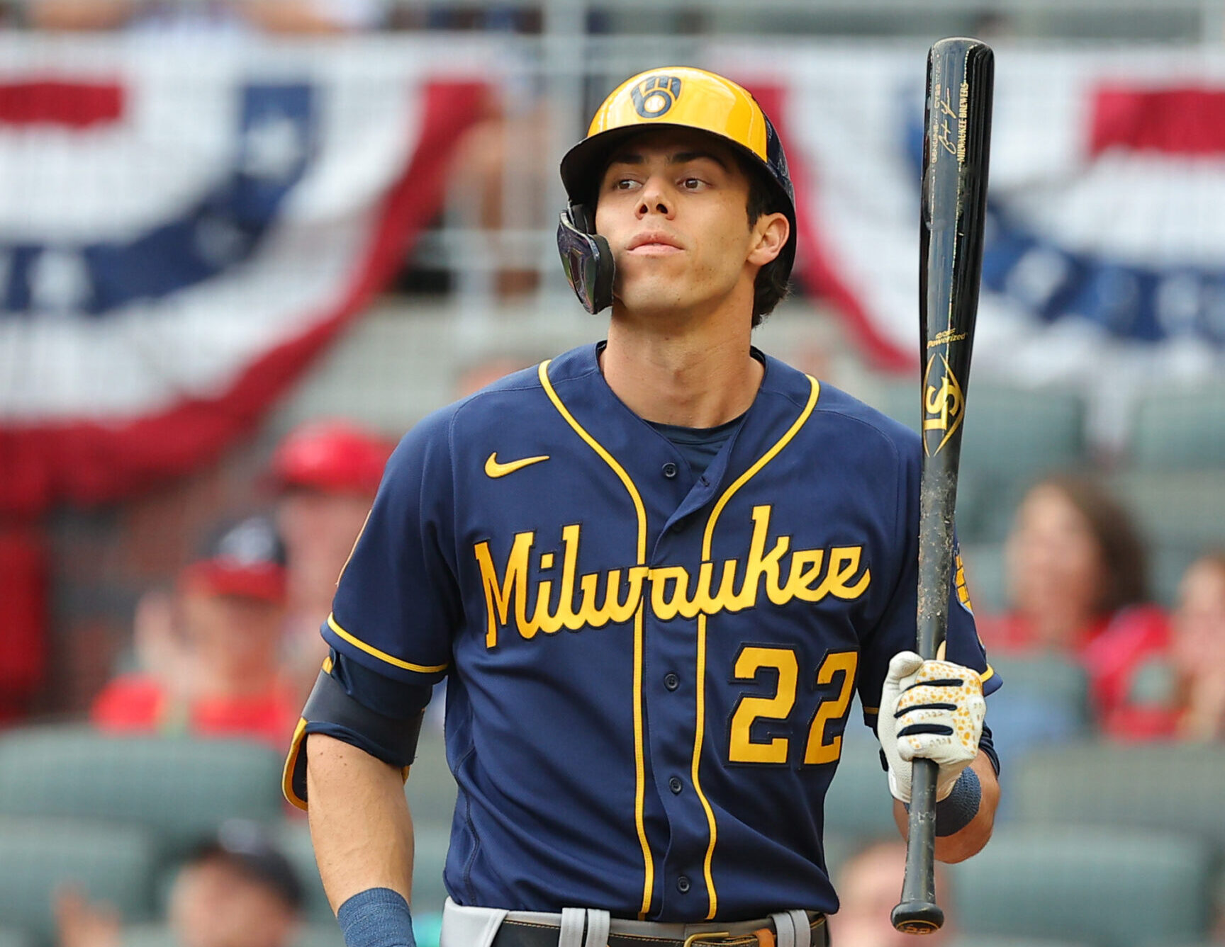 Christian Yelich #22 of the Milwaukee Brewers bats during the second inning against the Atlanta Braves in game four of the National League Division Series at Truist Park on October 12, 2021 in Atlanta, Georgia.