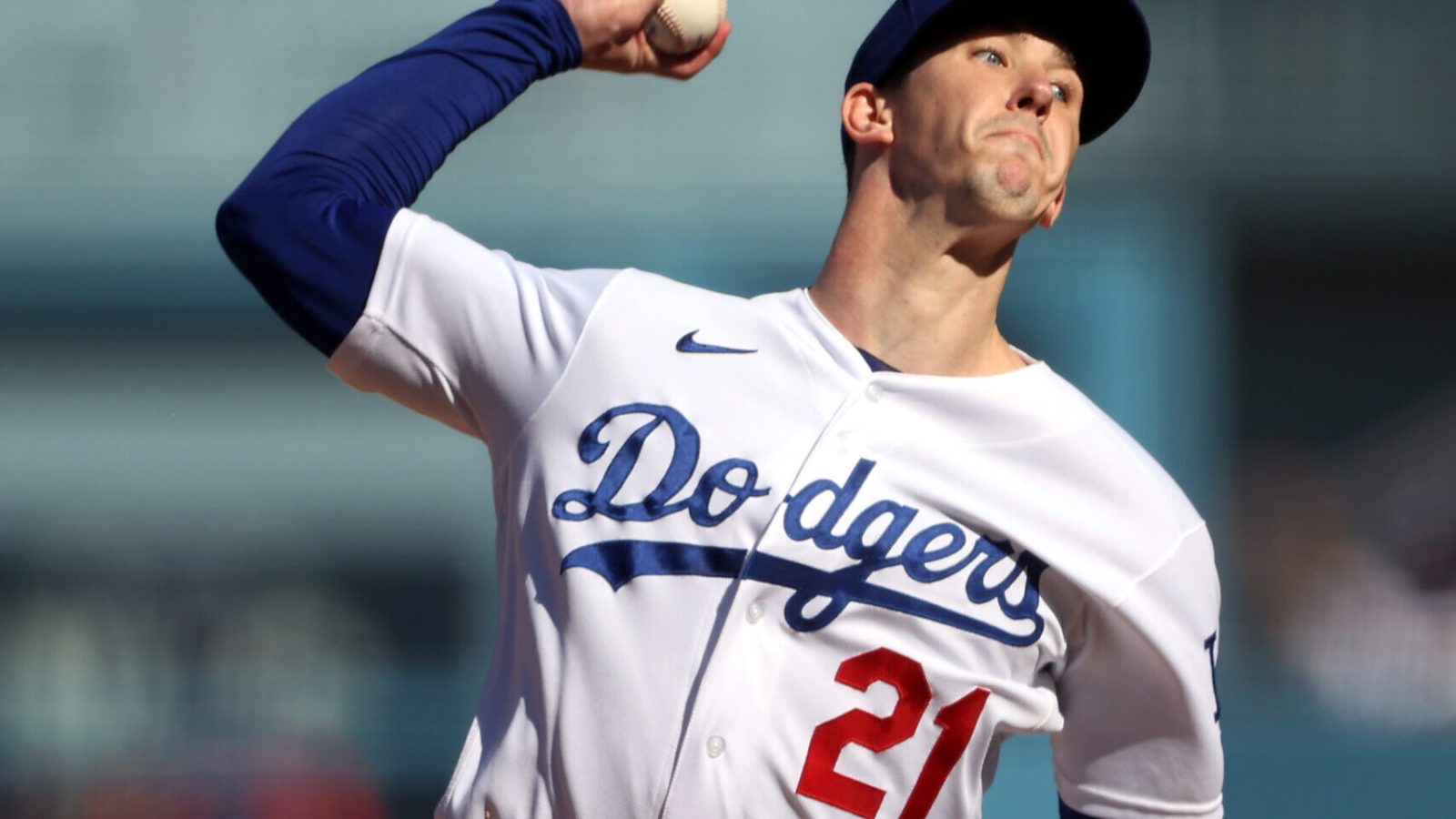 Starting pitcher Walker Buehler #21 of the Los Angeles Dodgers pitches during the 1st inning of the National League Championship Series against the Atlanta Braves at Dodger Stadium