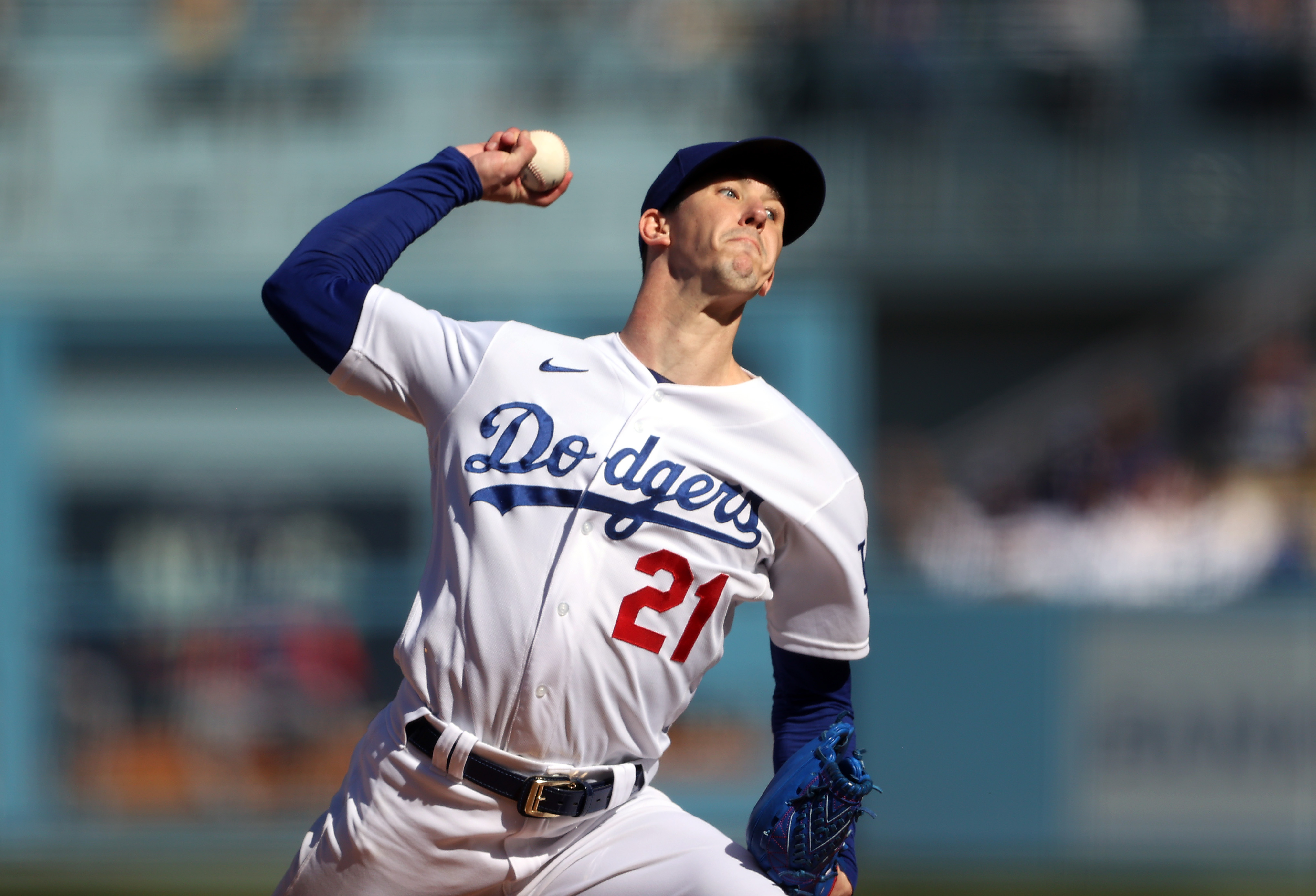 Starting pitcher Walker Buehler #21 of the Los Angeles Dodgers pitches during the 1st inning of the National League Championship Series against the Atlanta Braves at Dodger Stadium
