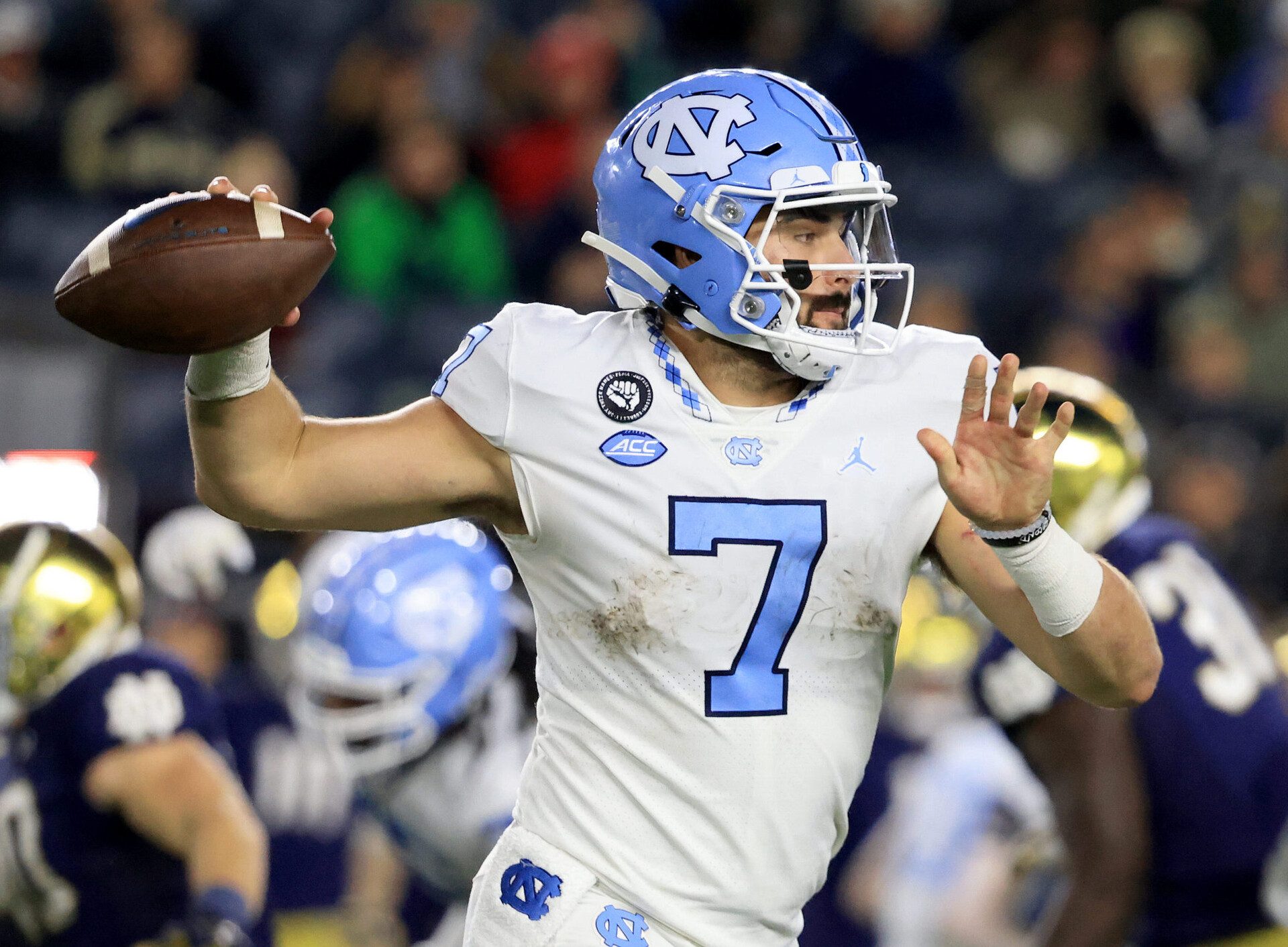 North Carolina quarterback Sam Howell looks to pass during a game in the 2021-22 season.
